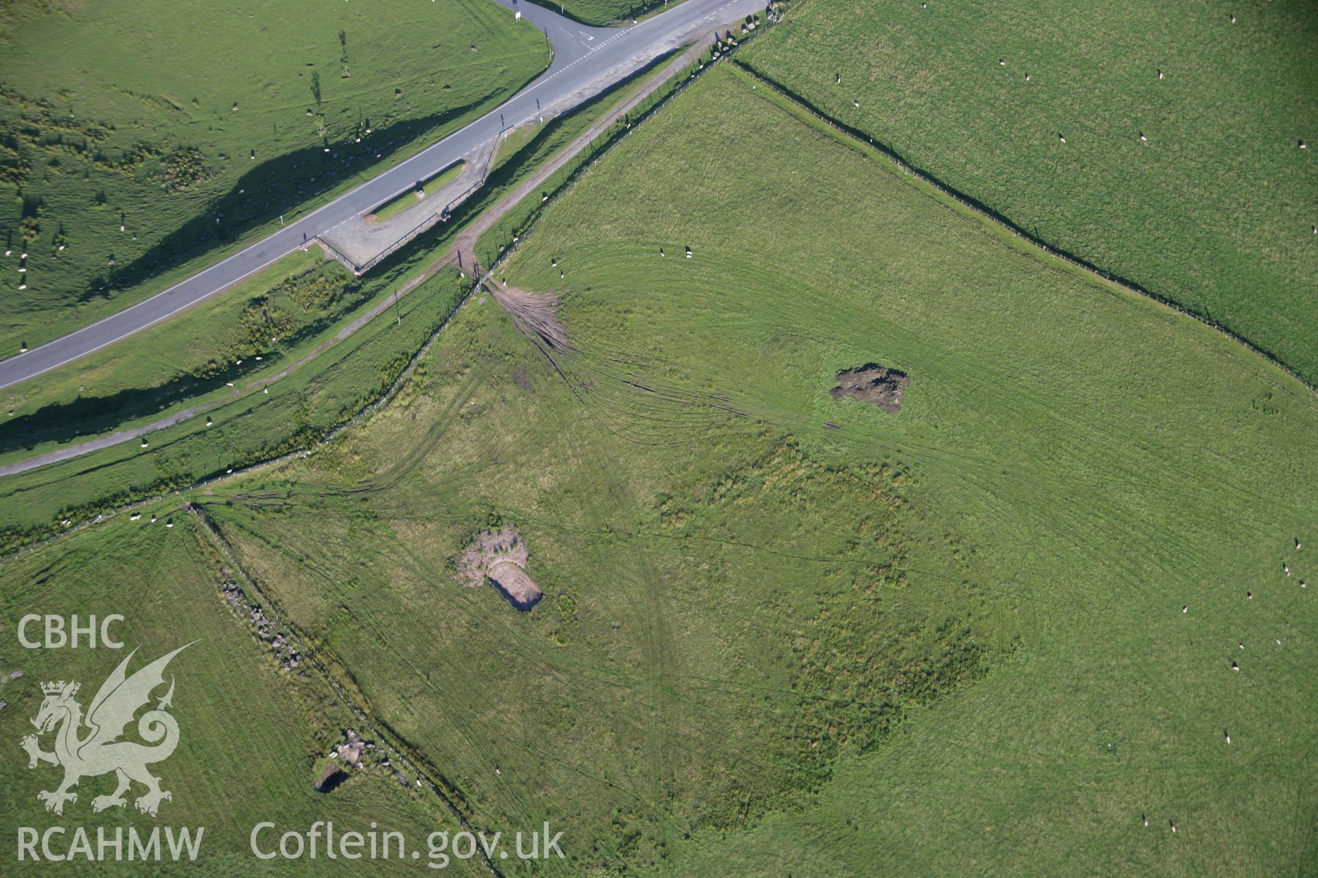 RCAHMW colour oblique aerial photograph of Blaen Clydach Fach Cairns I and II. Taken on 08 August 2007 by Toby Driver
