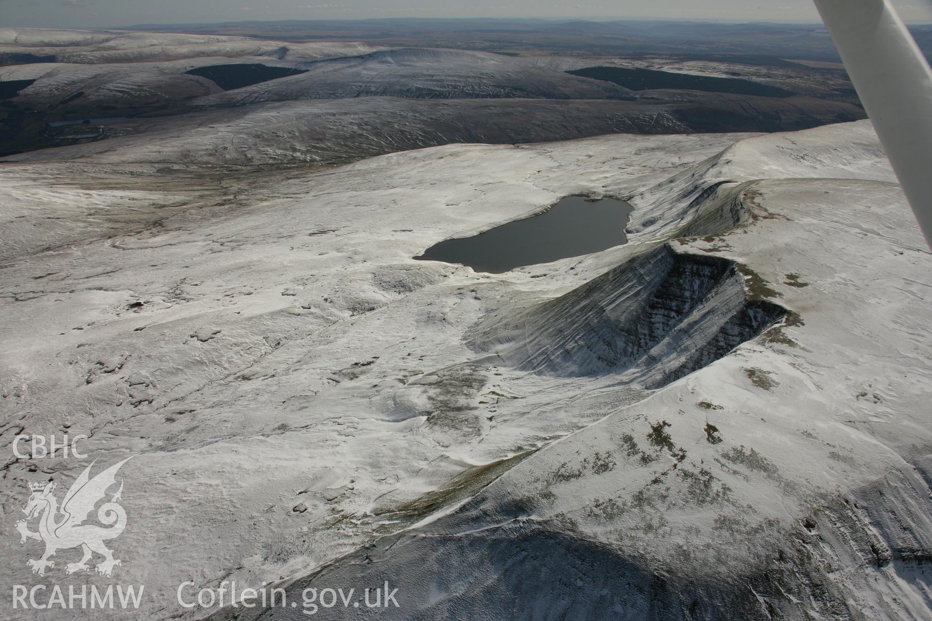 RCAHMW colour oblique aerial photograph of Fan Foel Round Barrow. Taken on 21 March 2007 by Toby Driver