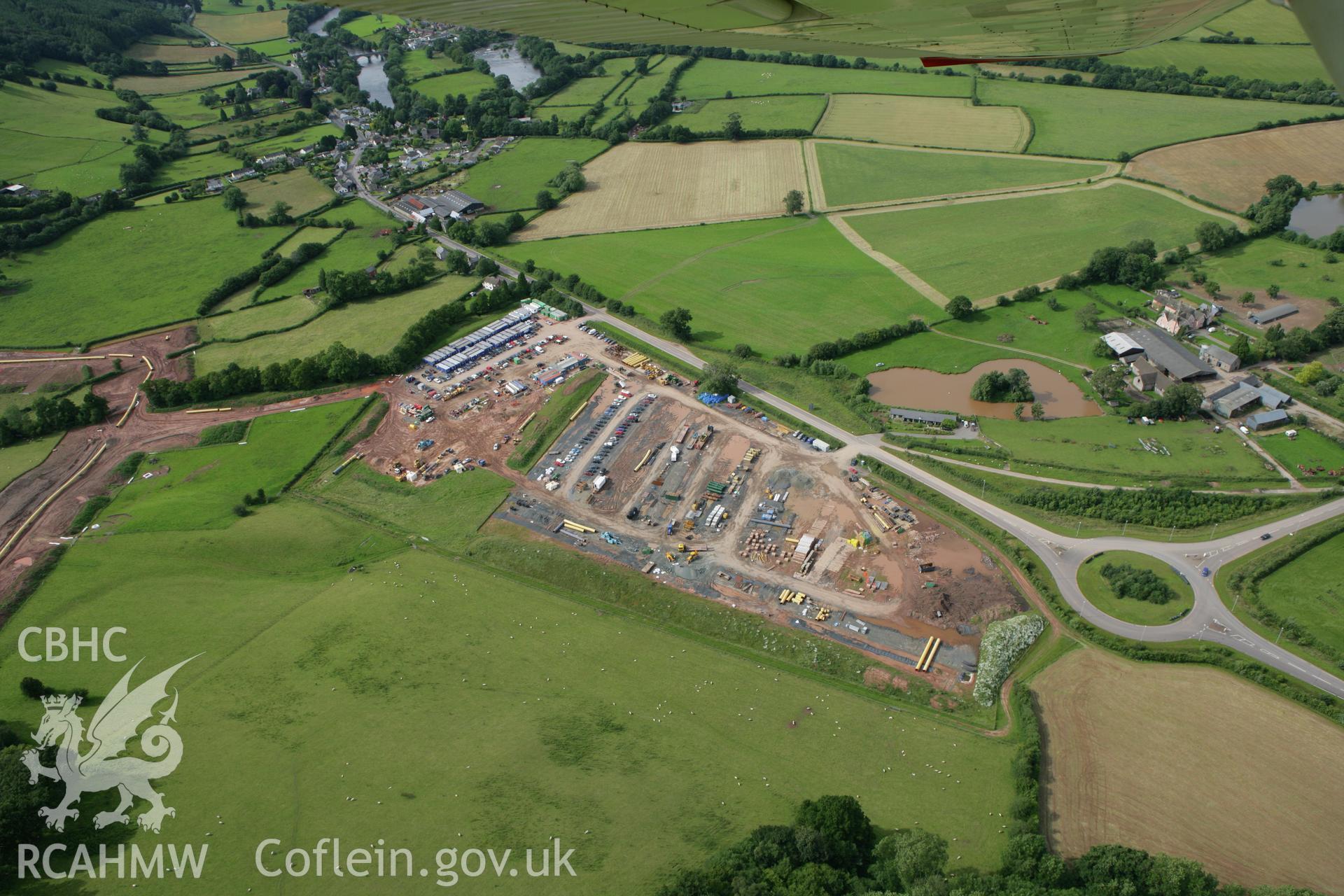 RCAHMW colour oblique aerial photograph of Llyswen Liquified Natural Gas (LNG) Pipeline Depot. Taken on 09 July 2007 by Toby Driver