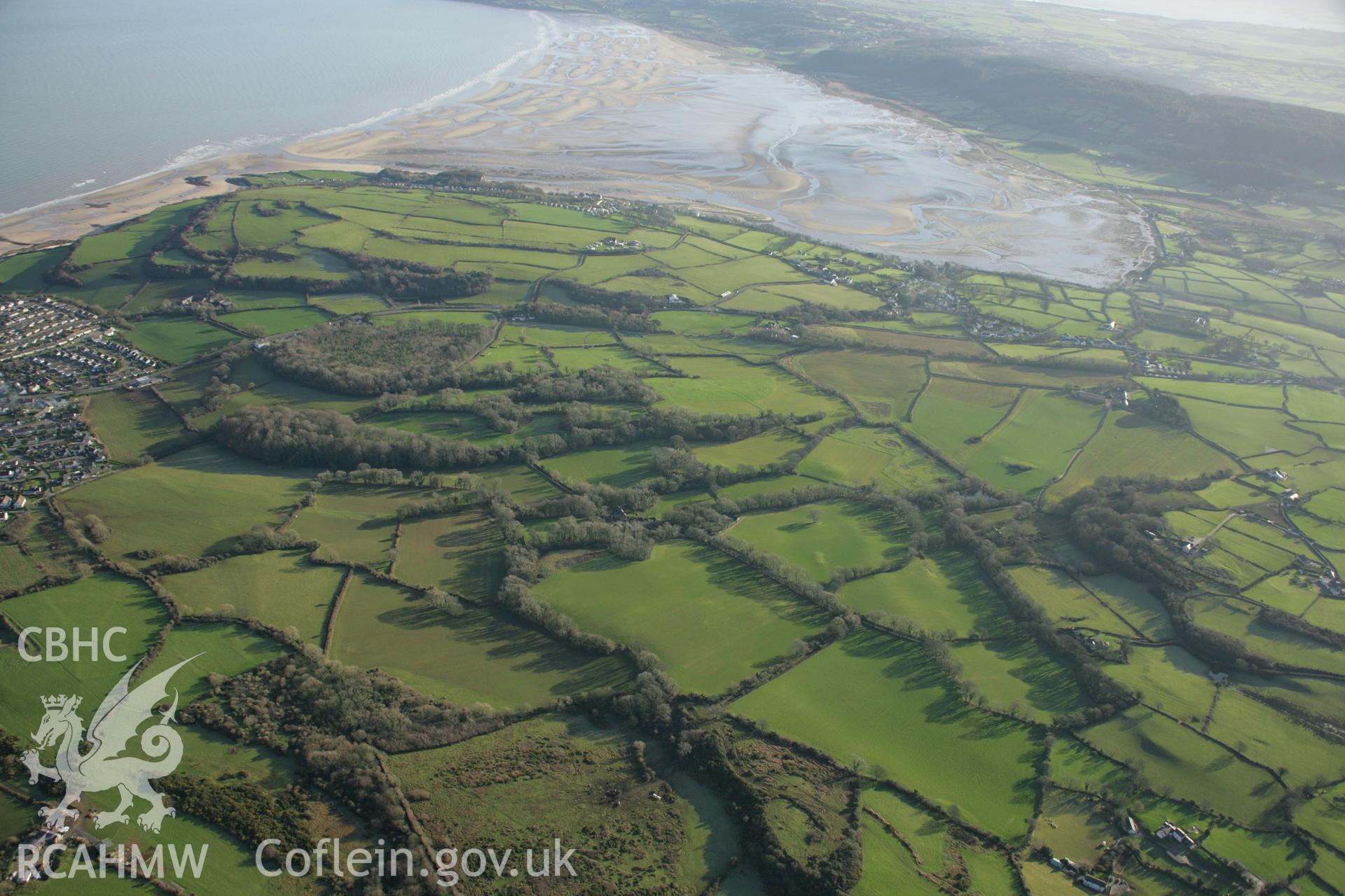 RCAHMW colour oblique aerial photograph of the Viking settlement at Glyn, Llanbedrgoch. Taken on 25 January 2007 by Toby Driver