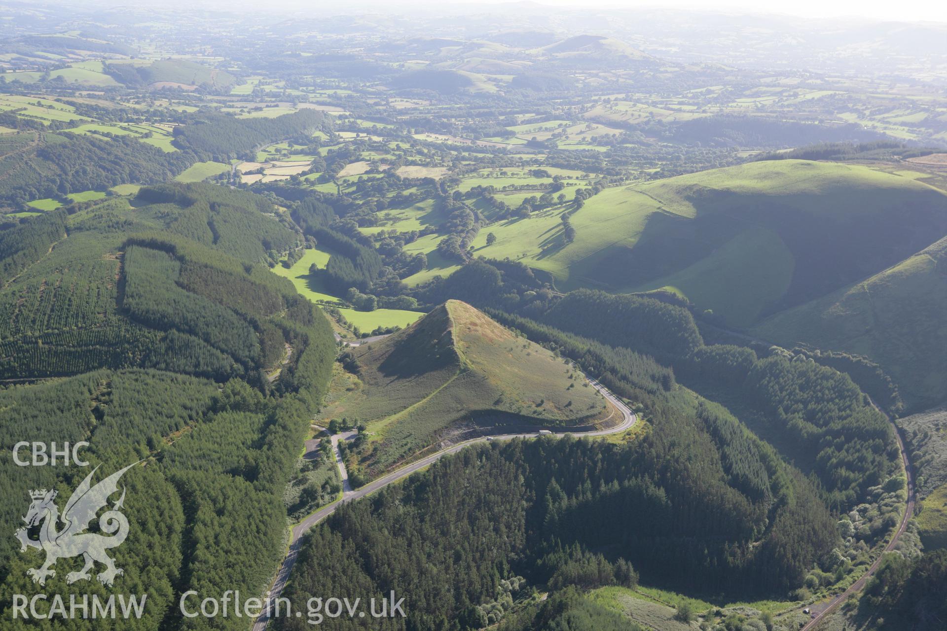 RCAHMW colour oblique aerial photograph of Sugar Loaf Hillfort. Taken on 08 August 2007 by Toby Driver