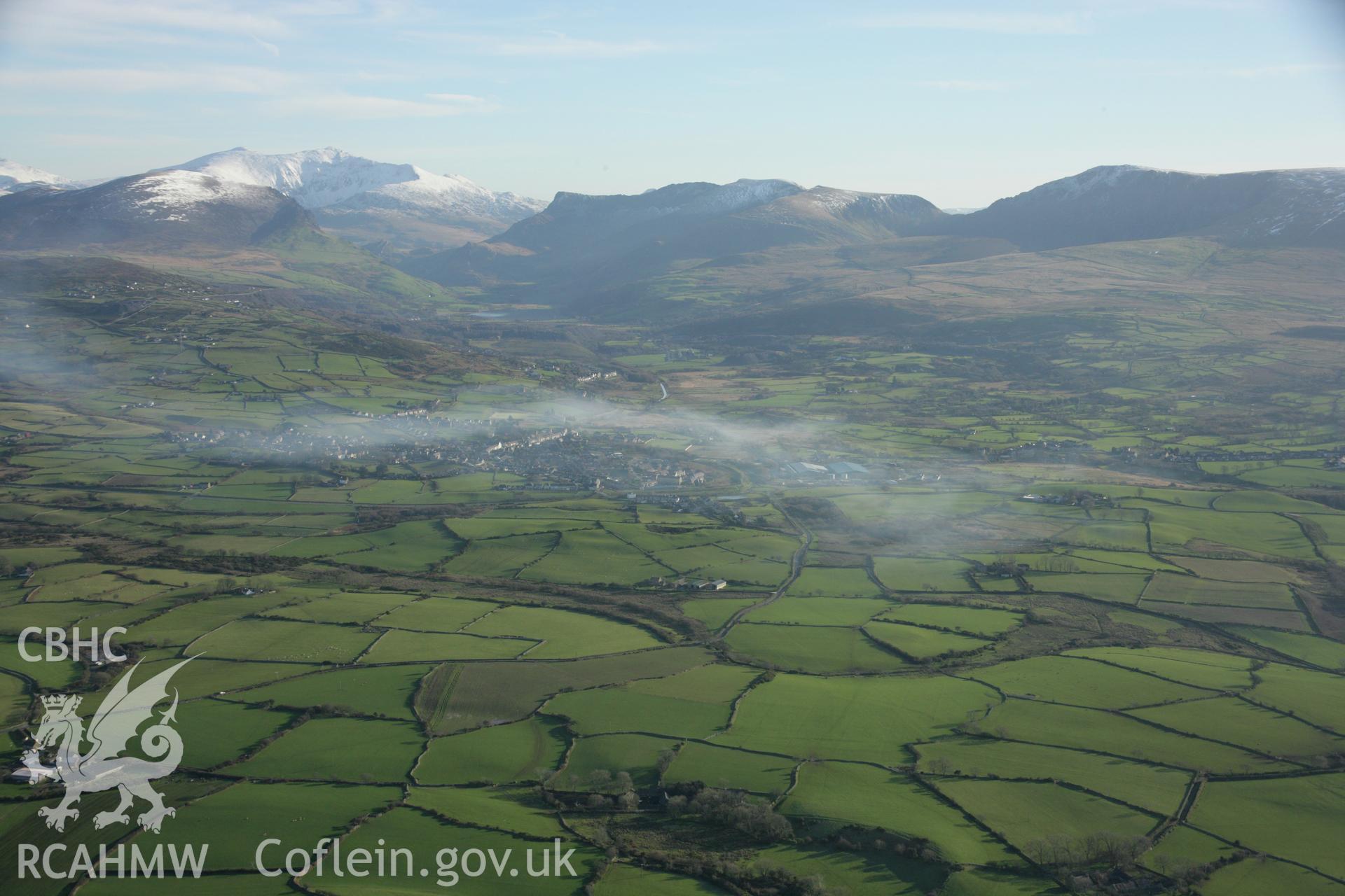 RCAHMW colour oblique aerial photograph showing a landscape view of the Penygroes Village, viewed from the West. Taken on 25 January 2007 by Toby Driver