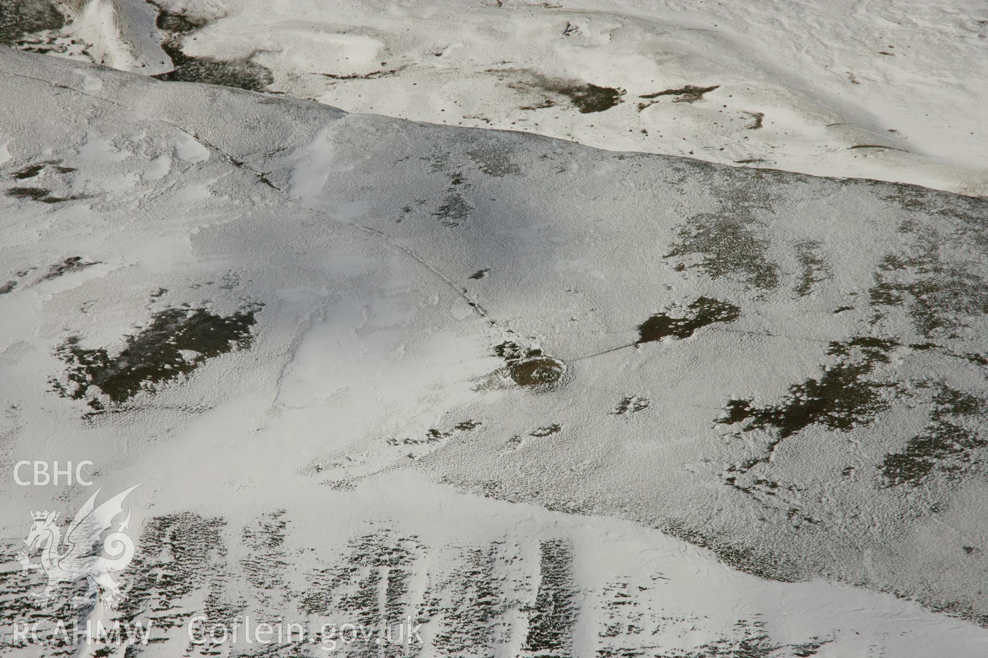 RCAHMW colour oblique aerial photograph of Fan Foel Round Barrow. Taken on 21 March 2007 by Toby Driver