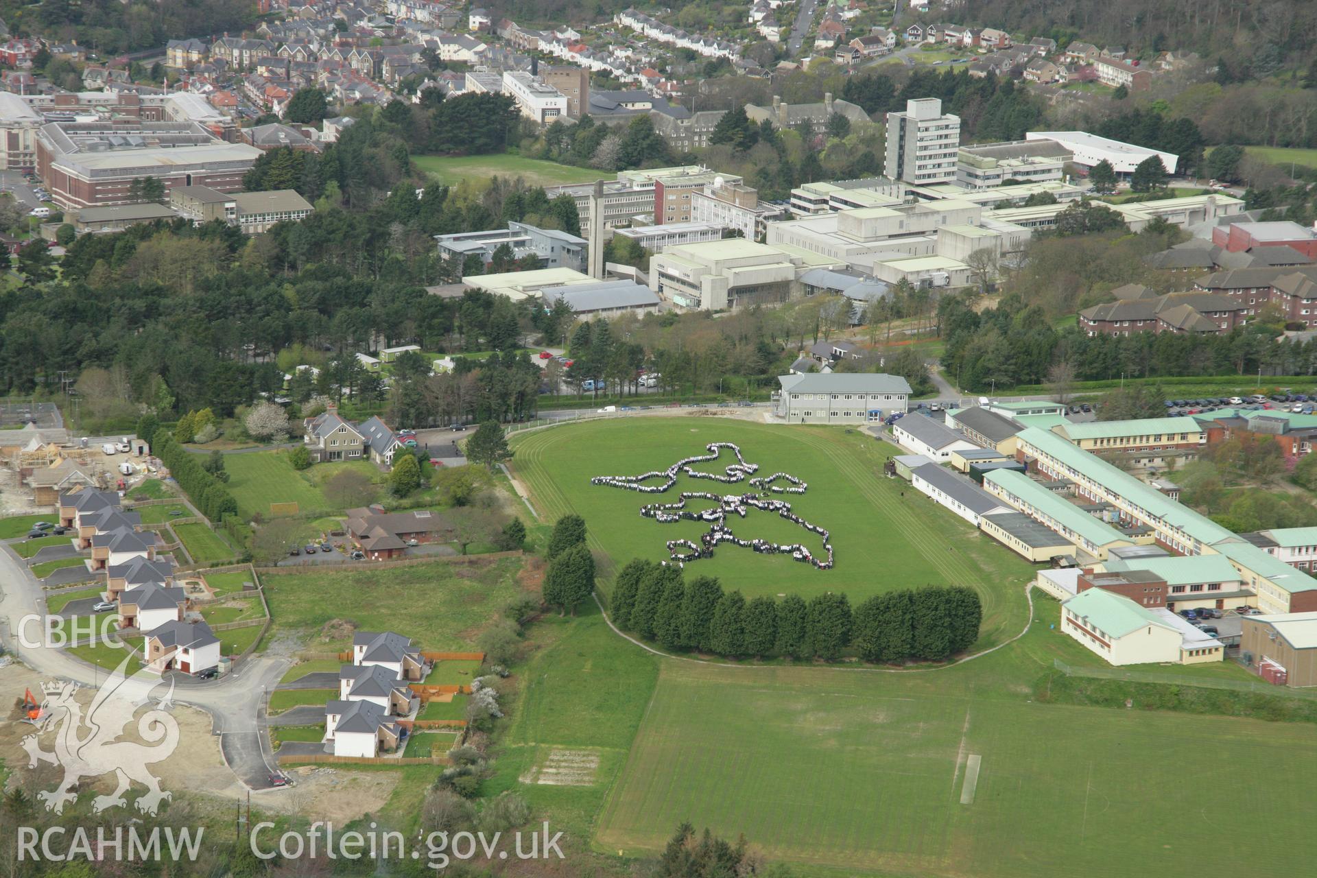 RCAHMW colour oblique aerial photograph of Penglais Comprehensive School, World Map of 1500 pupils. Taken on 17 April 2007 by Toby Driver