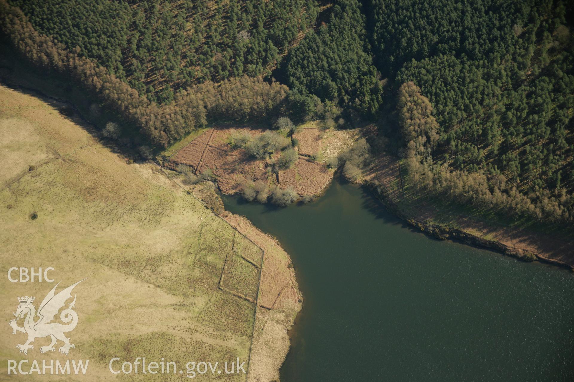 RCAHMW colour oblique aerial photograph of Upper Lliw Reservoir Valve House and deserted farm. Taken on 21 March 2007 by Toby Driver