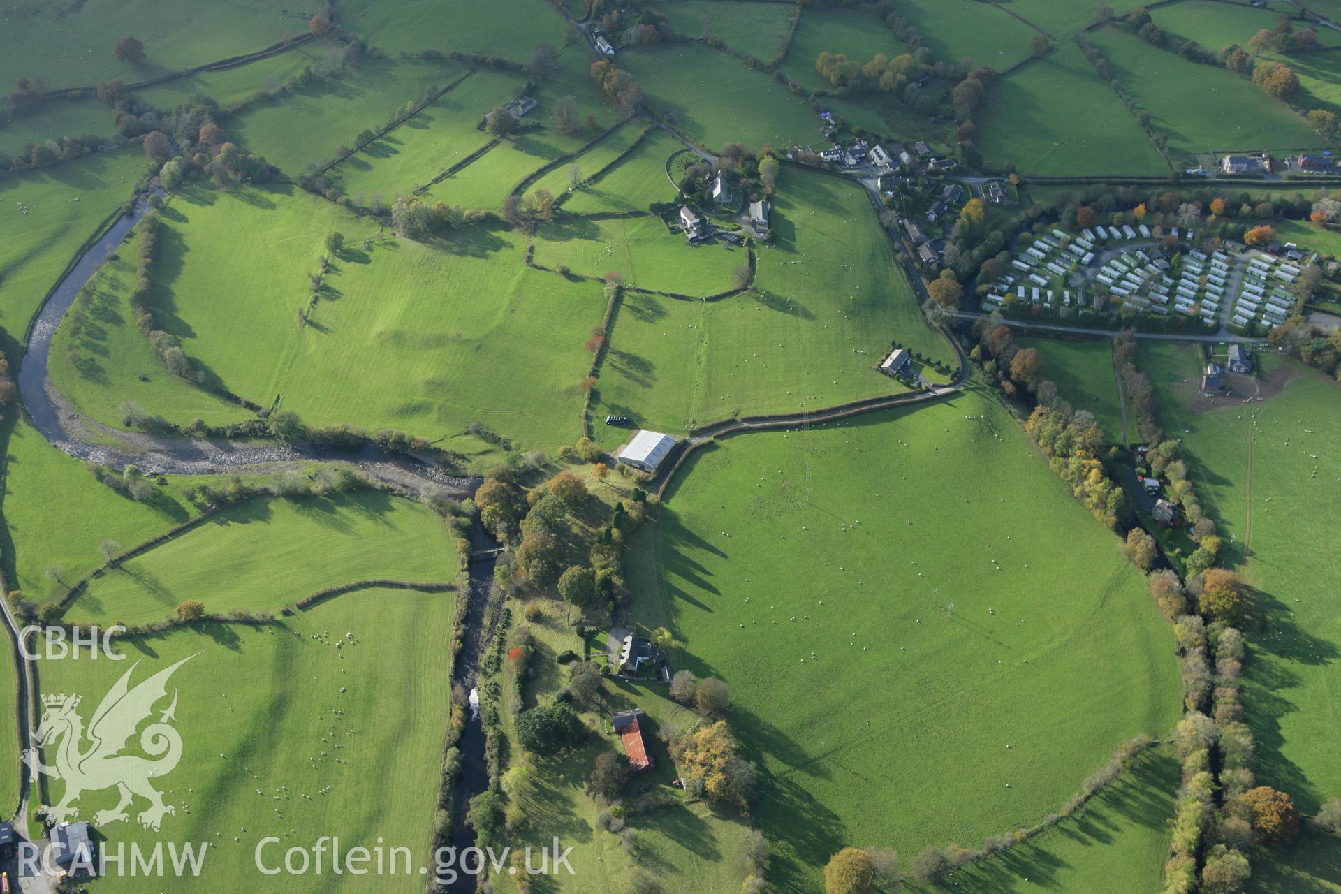 RCAHMW colour oblique photograph of St Cadfan's Church, and surrounding earthworks of former field boundaries. Taken by Toby Driver on 30/10/2007.