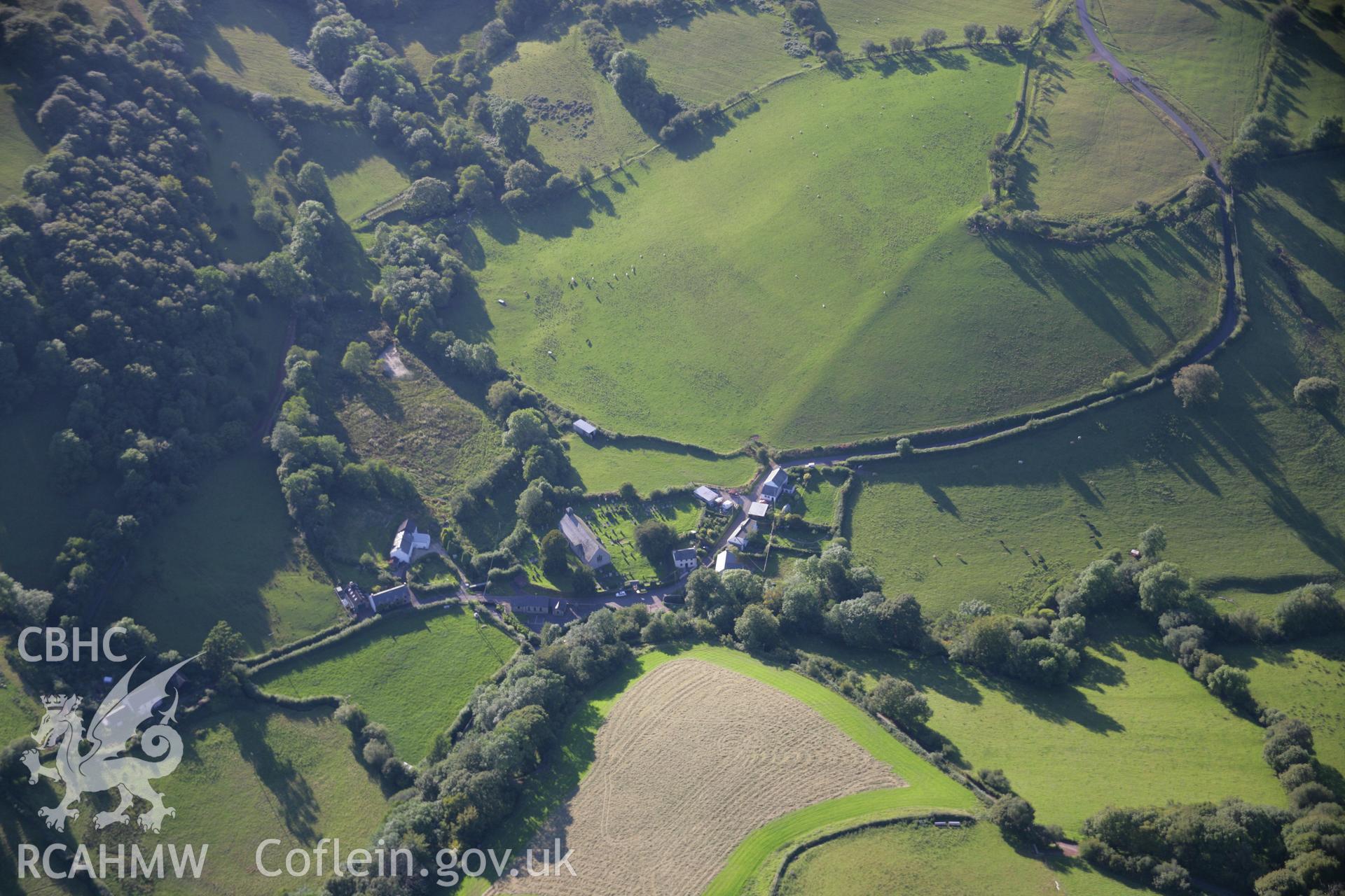 RCAHMW colour oblique aerial photograph of Llandeilo'r Fan village. Taken on 08 August 2007 by Toby Driver