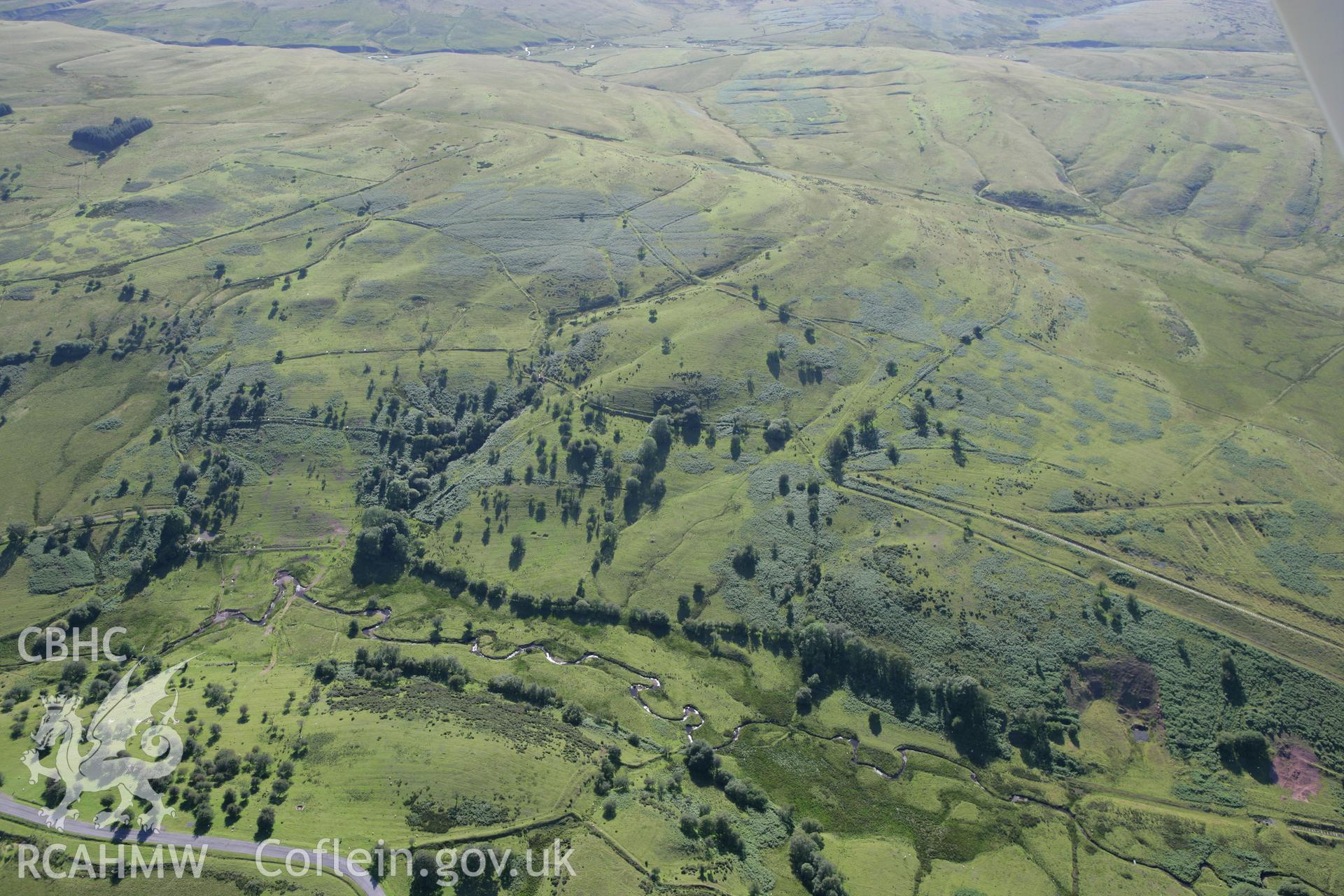 RCAHMW colour oblique aerial photograph of Llawr-y-Dolau. Taken on 08 August 2007 by Toby Driver