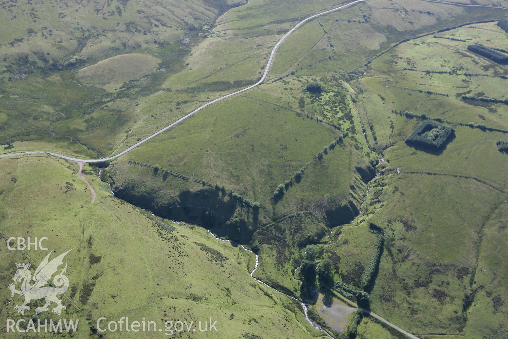 RCAHMW colour oblique aerial photograph of the landscape near Dolau Gwynion at Llangammarch Wells. Taken on 08 August 2007 by Toby Driver
