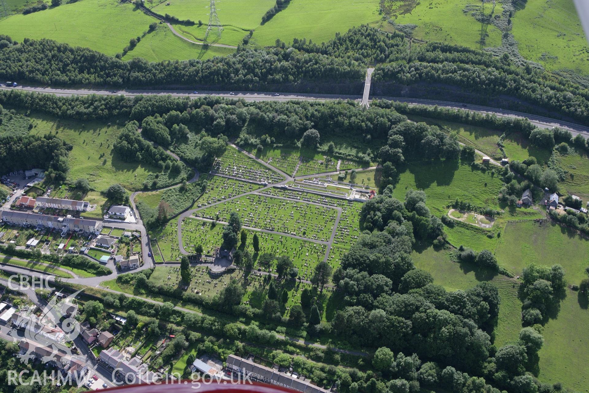 RCAHMW colour oblique aerial photograph of Aberfan Cemetery viewed from the north-east. Taken on 30 July 2007 by Toby Driver