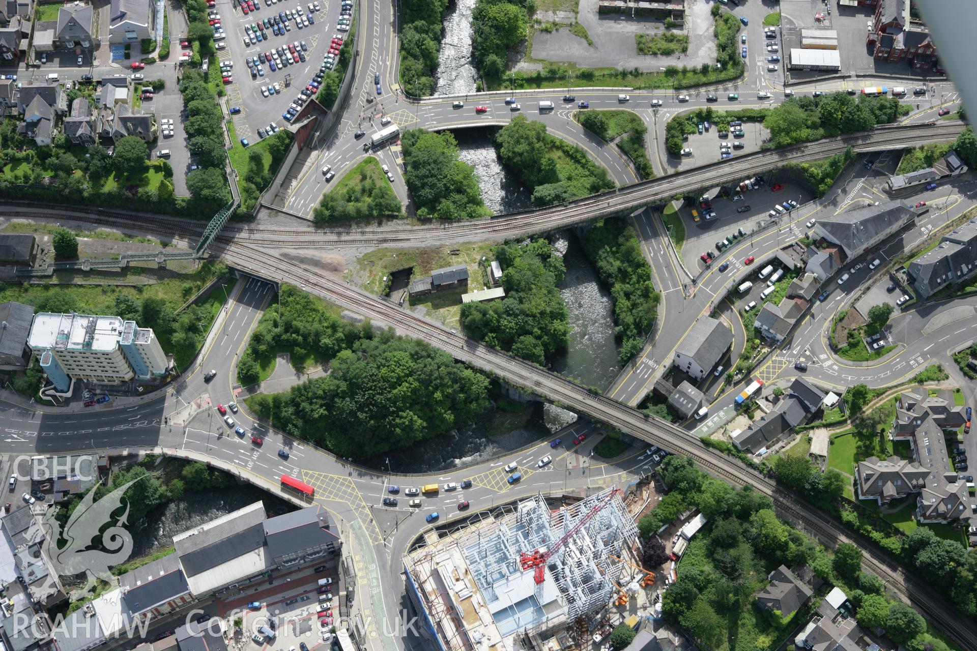 RCAHMW colour oblique aerial photograph of Pontypridd showing the railway junction and nearby roads. Taken on 30 July 2007 by Toby Driver