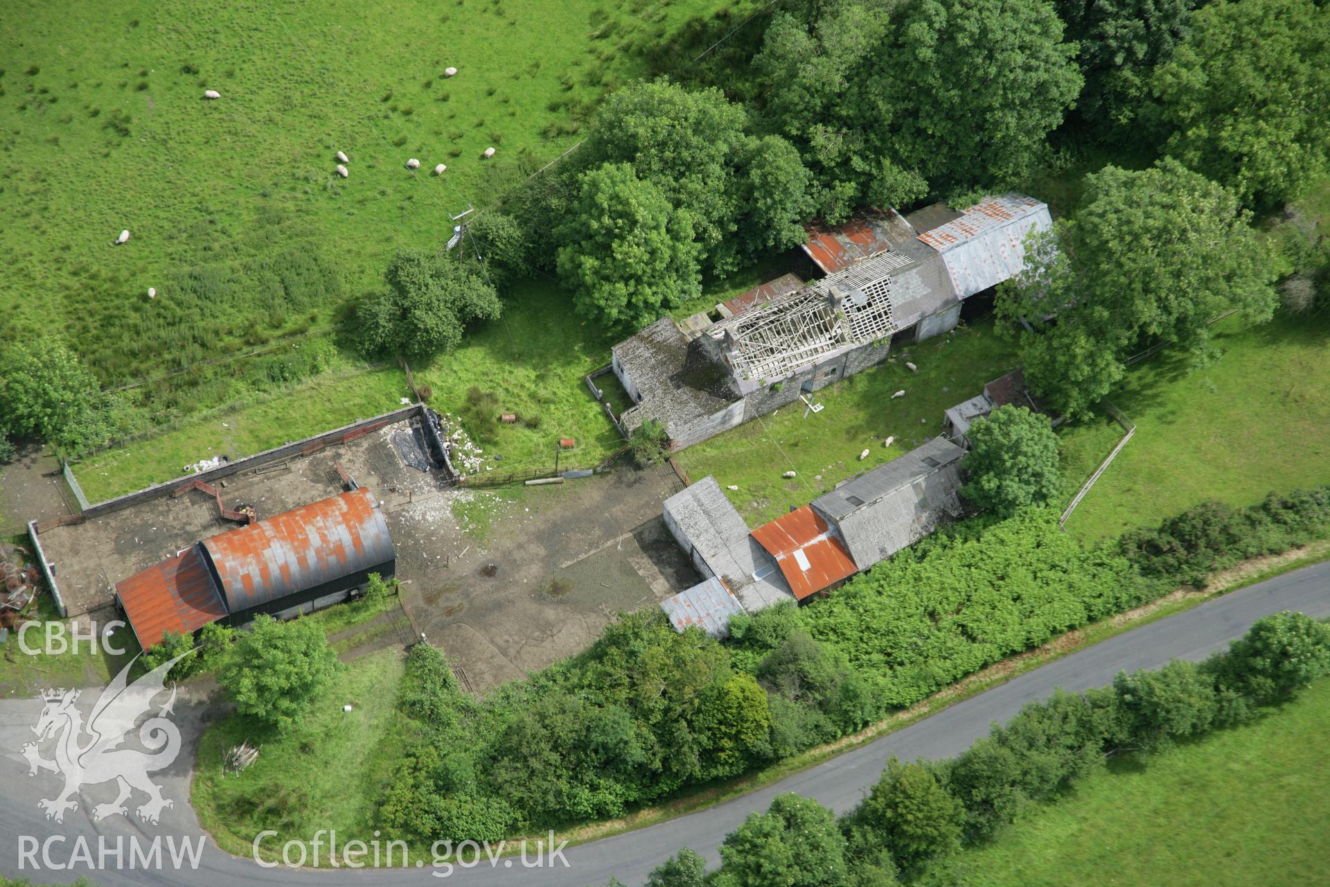 RCAHMW colour oblique aerial photograph of Spite Inn, showing the building prior to demolition. Taken on 09 July 2007 by Toby Driver