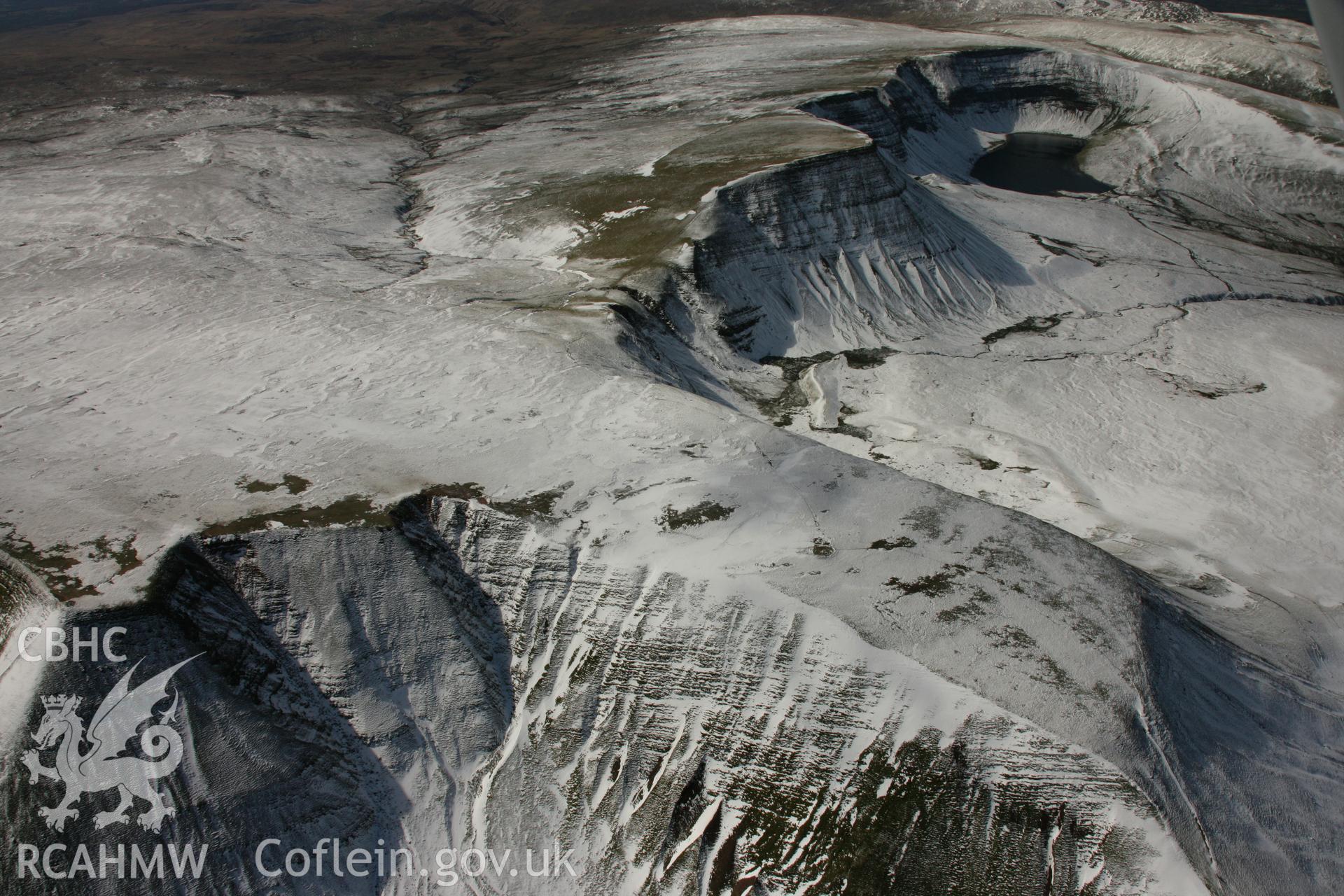 RCAHMW colour oblique aerial photograph of Fan Foel Round Barrow. Taken on 21 March 2007 by Toby Driver
