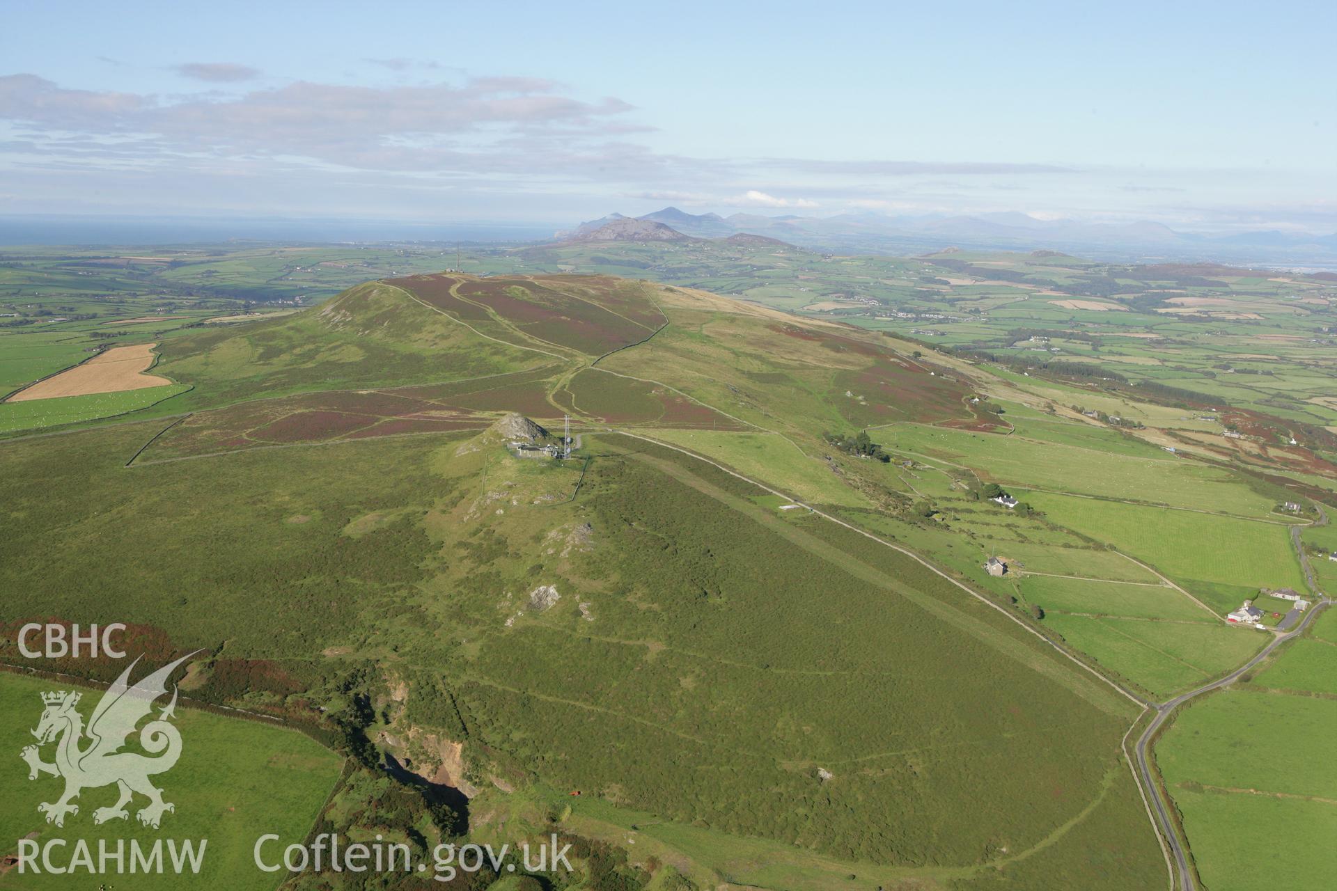 RCAHMW colour oblique aerial photograph showing landscape of Neolithic Axe Factory, Mynydd Rhiw. Taken on 06 September 2007 by Toby Driver