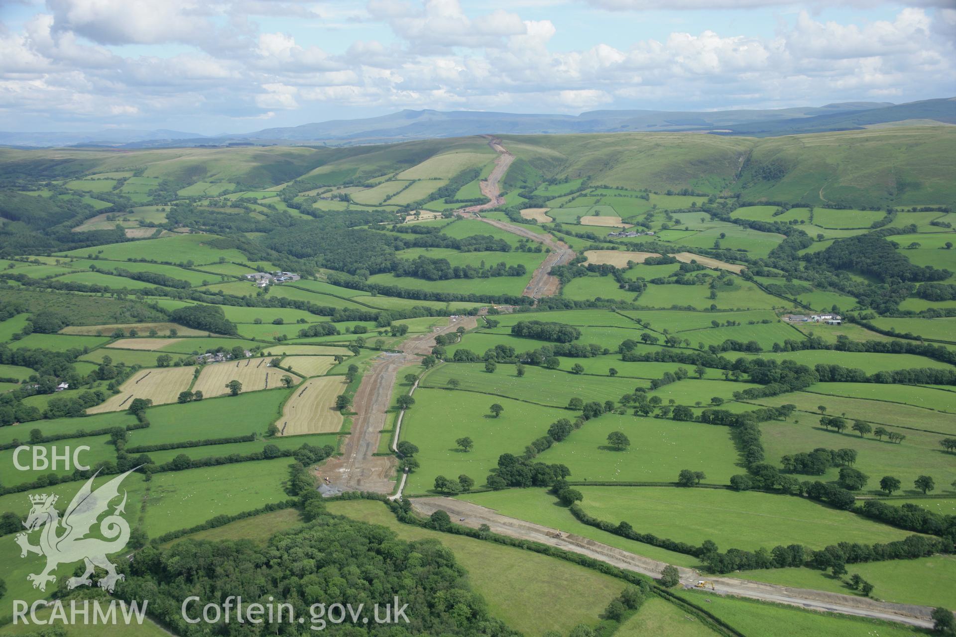 RCAHMW colour oblique aerial photograph of LNG pipeline approaching Mynydd Myddfai. Taken on 09 July 2007 by Toby Driver