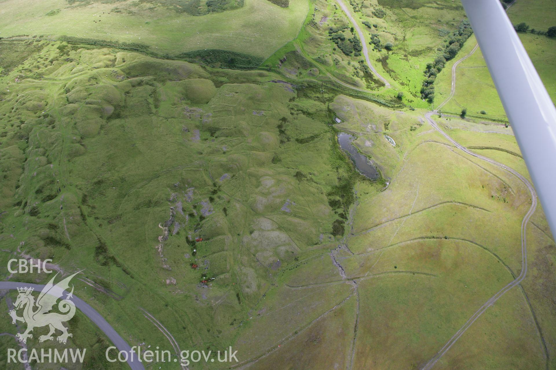 RCAHMW colour oblique aerial photograph of the deserted Ffos y Fran Ironstone Workers Settlement. Taken on 30 July 2007 by Toby Driver