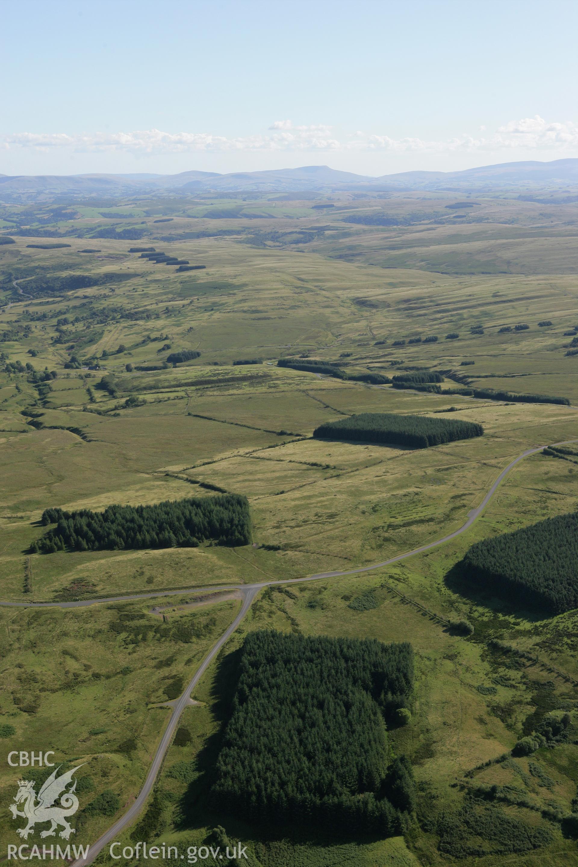 RCAHMW colour oblique aerial photograph of Sennybridge Military Training Area, Mynydd Epynt, looking south-west and showing the Cefn Corast landscape. Taken on 08 August 2007 by Toby Driver