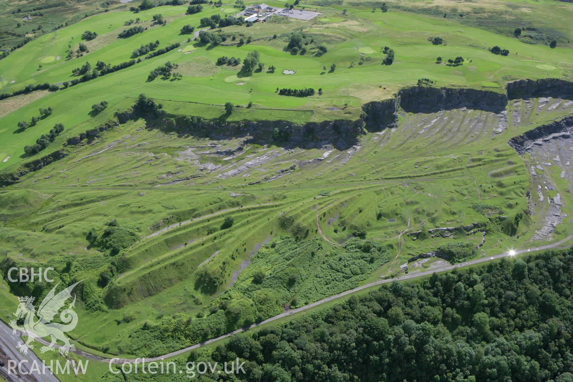RCAHMW colour oblique aerial photograph of Morlais Castle Quarries (East). Taken on 30 July 2007 by Toby Driver
