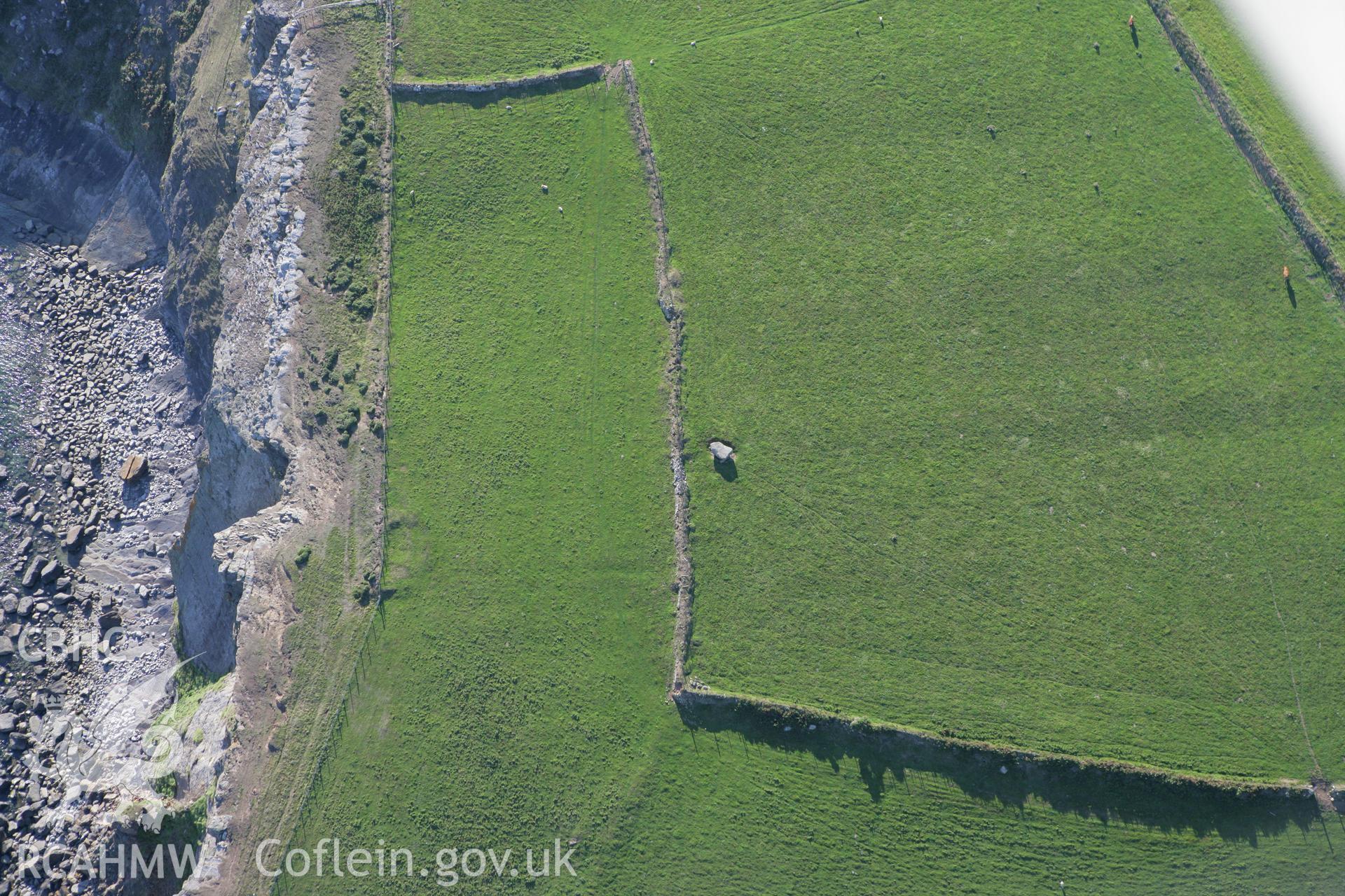 RCAHMW colour oblique aerial photograph of Chambered Tomb Cilan Uchaf. Taken on 06 September 2007 by Toby Driver