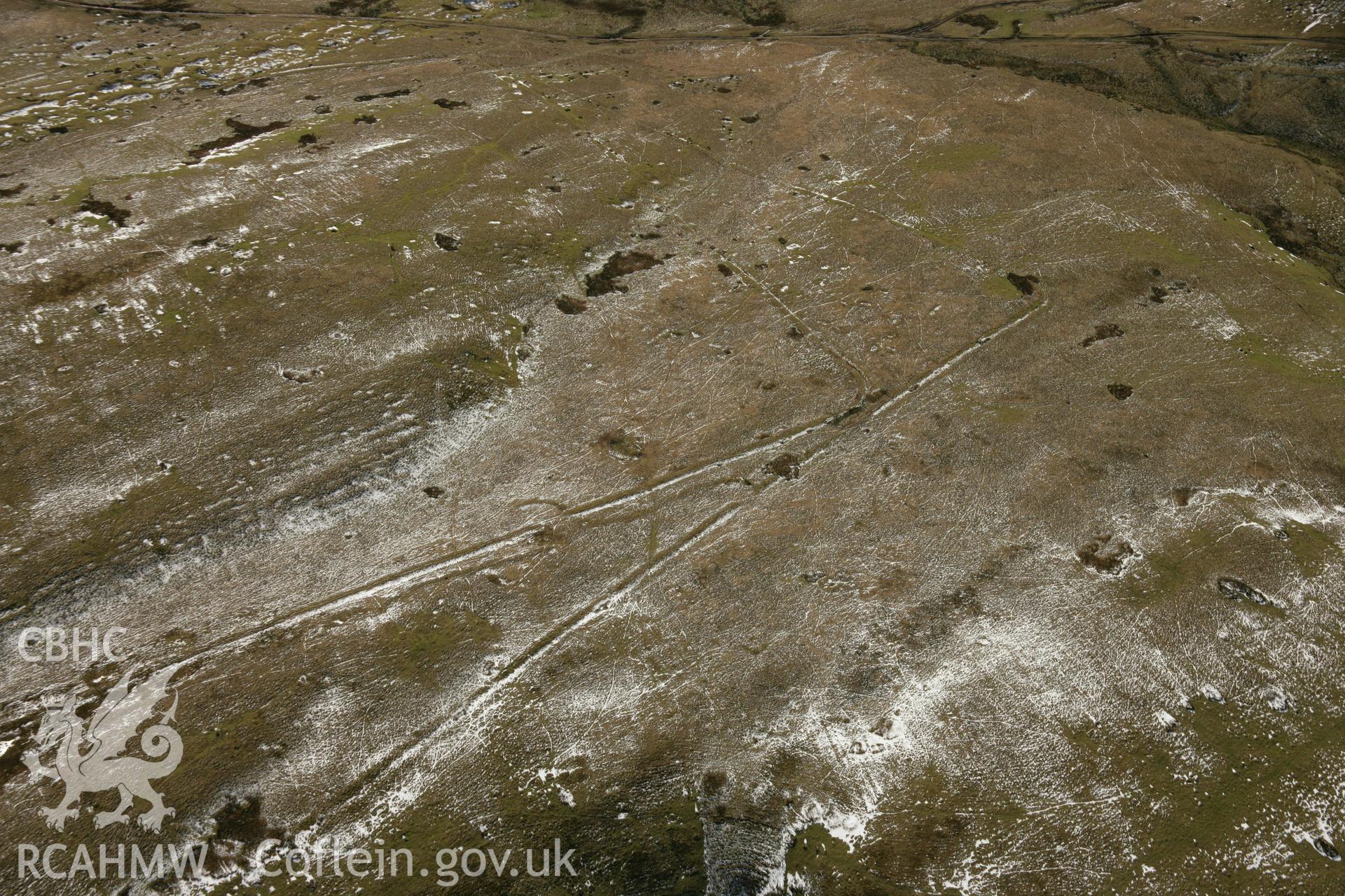 RCAHMW colour oblique aerial photograph of Y Pigwn Roman Camps, Mynydd Bach Trecastell. Taken on 21 March 2007 by Toby Driver