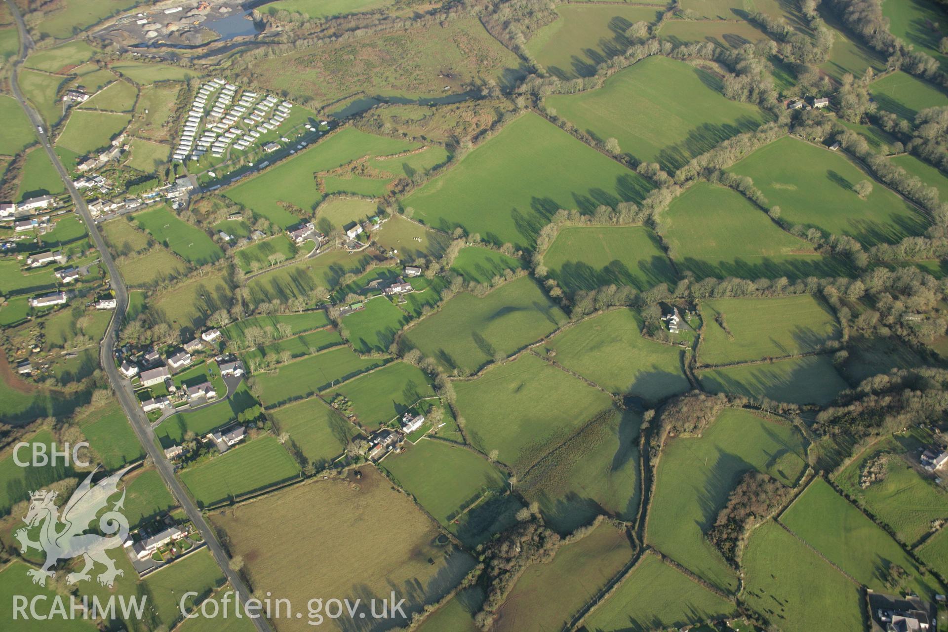 RCAHMW colour oblique aerial photograph of the Viking settlement at Glyn, Llanbedrgoch, and the surrounding landscape. Taken on 25 January 2007 by Toby Driver