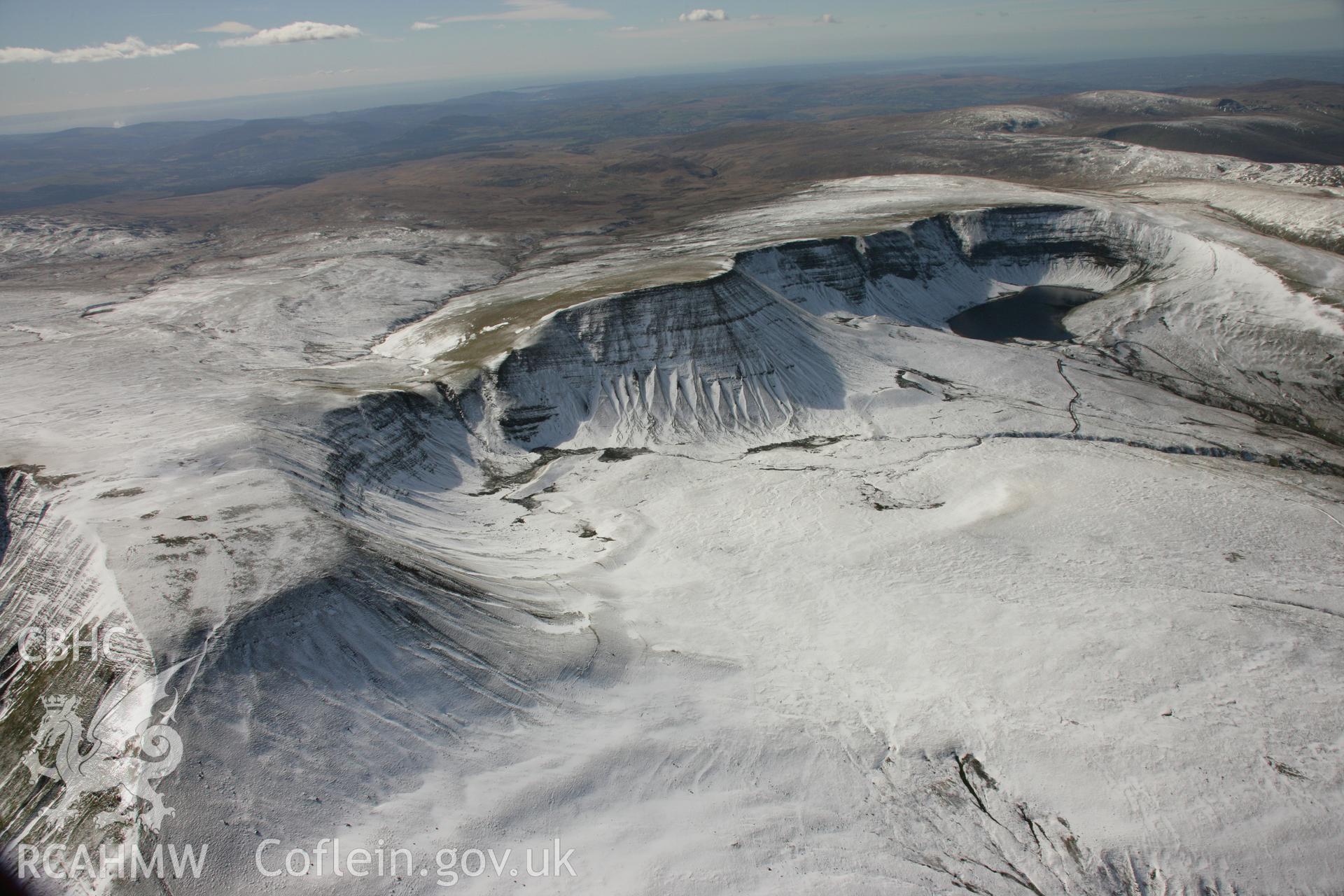 RCAHMW colour oblique aerial photograph of Llyn y Fan Fach in winter landscape viewed from the east. Taken on 21 March 2007 by Toby Driver