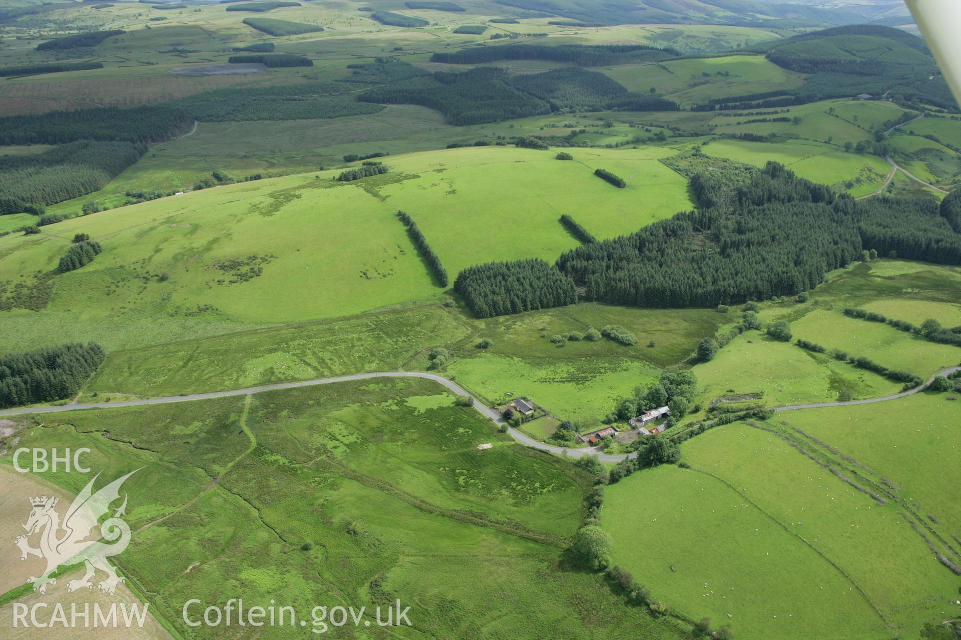 RCAHMW colour oblique aerial photograph of Spite Inn, showing the building prior to demolition. Taken on 09 July 2007 by Toby Driver