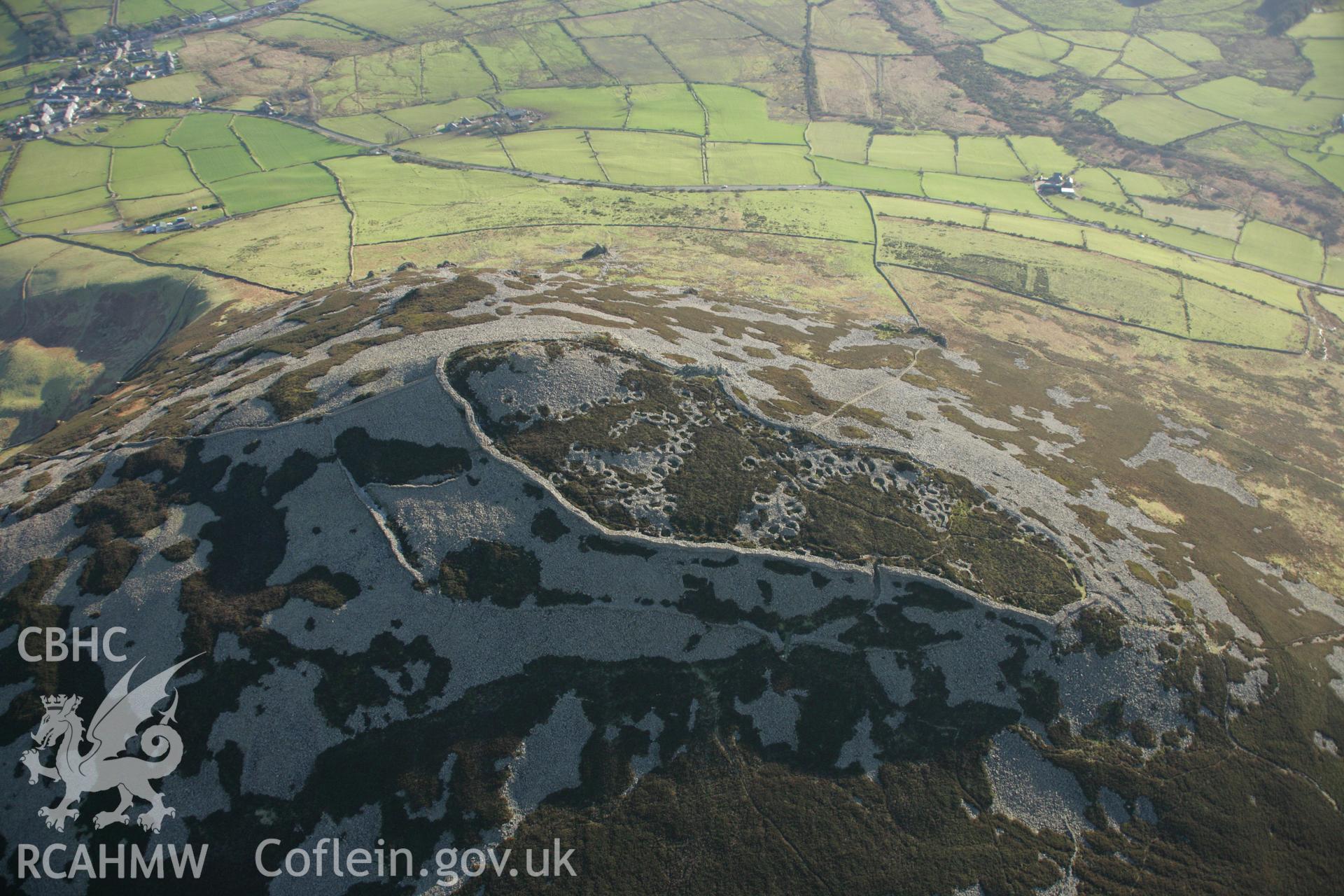 RCAHMW colour oblique aerial photograph of Tre'r Ceiri Fort, Llanaelhaearn. Taken on 25 January 2007 by Toby Driver