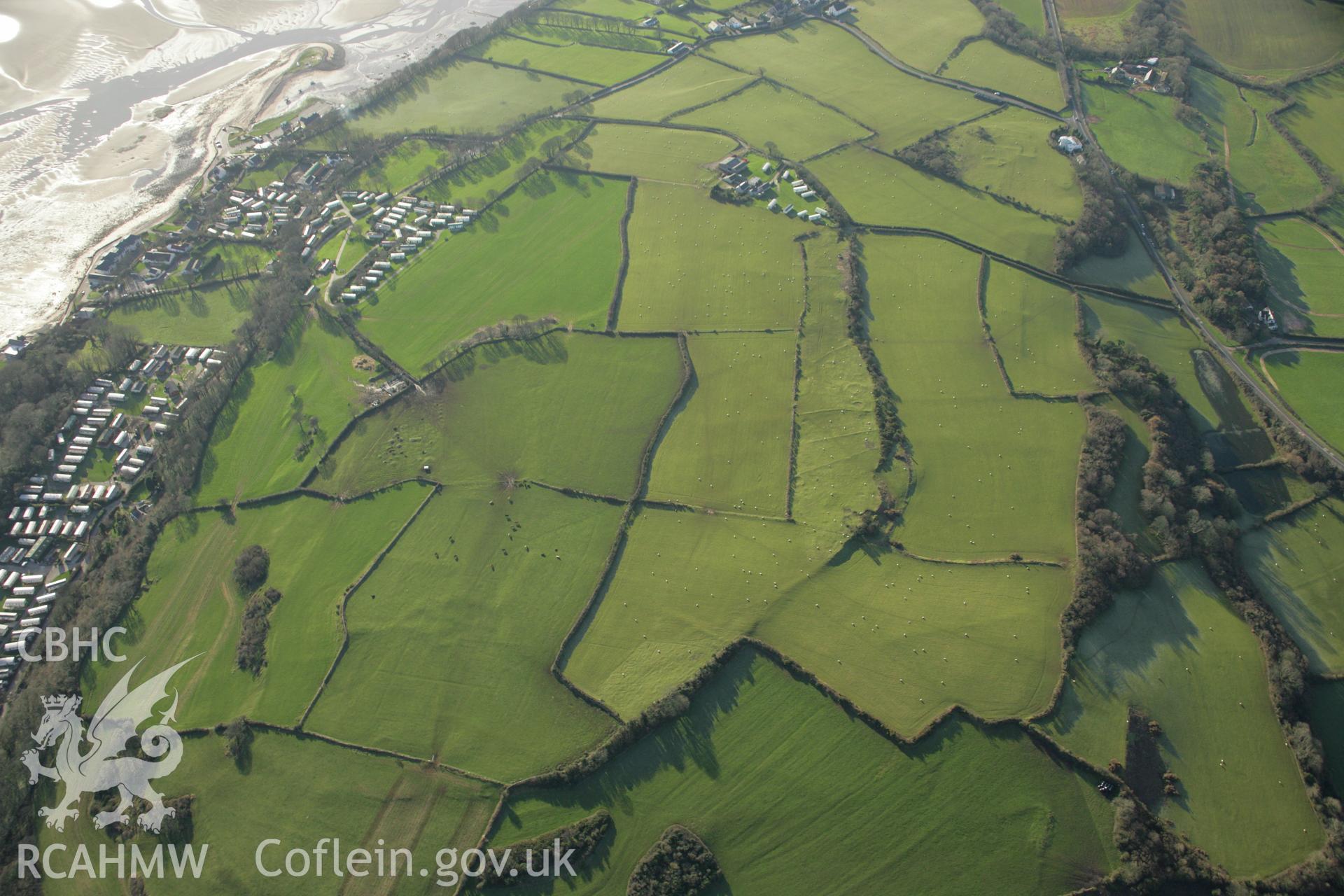 RCAHMW colour oblique aerial photograph of the Viking settlement at Glyn, Llanbedrgoch. Taken on 25 January 2007 by Toby Driver