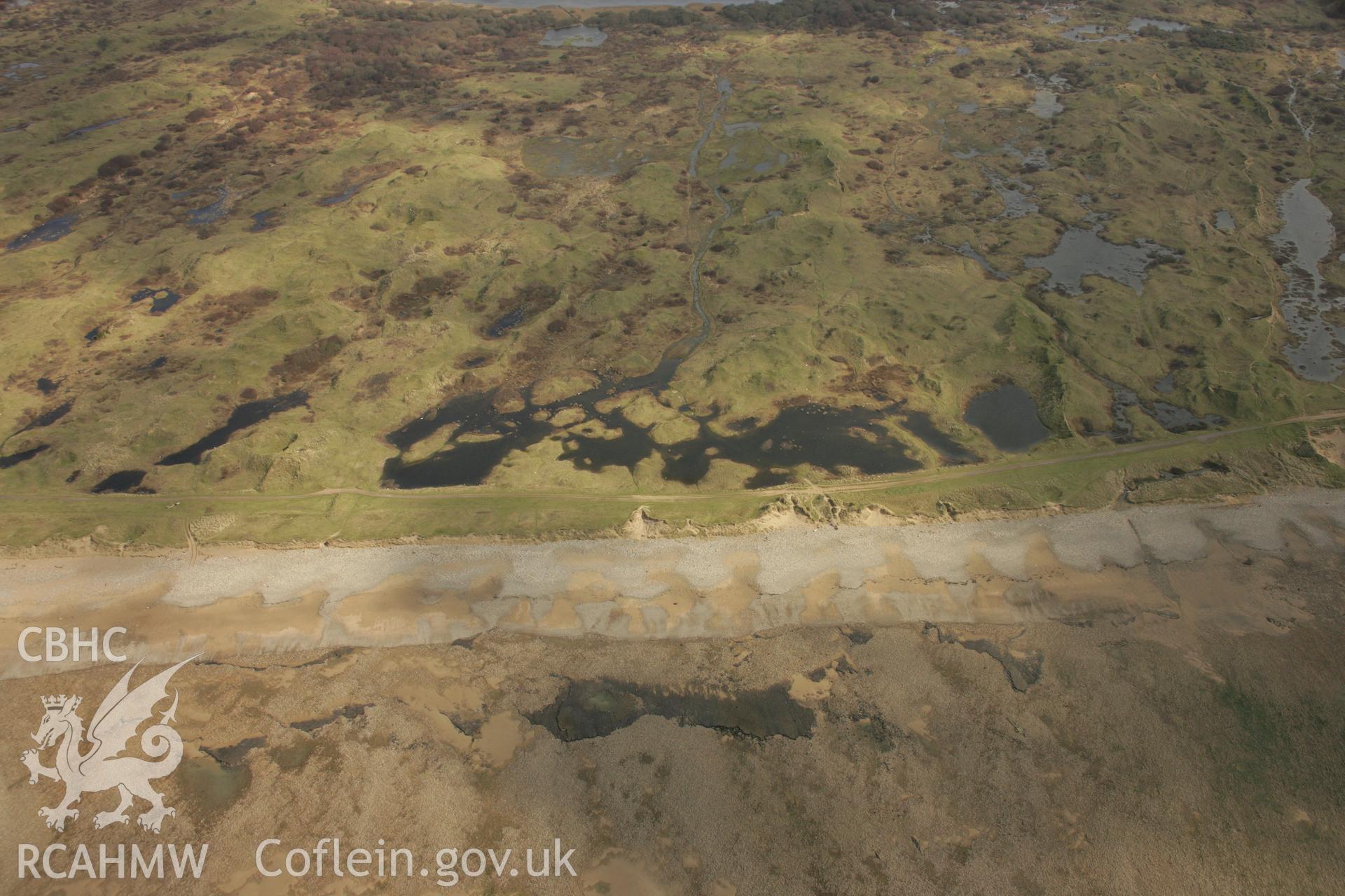 RCAHMW colour oblique aerial photograph of Kenfig Barrows. Taken on 16 March 2007 by Toby Driver