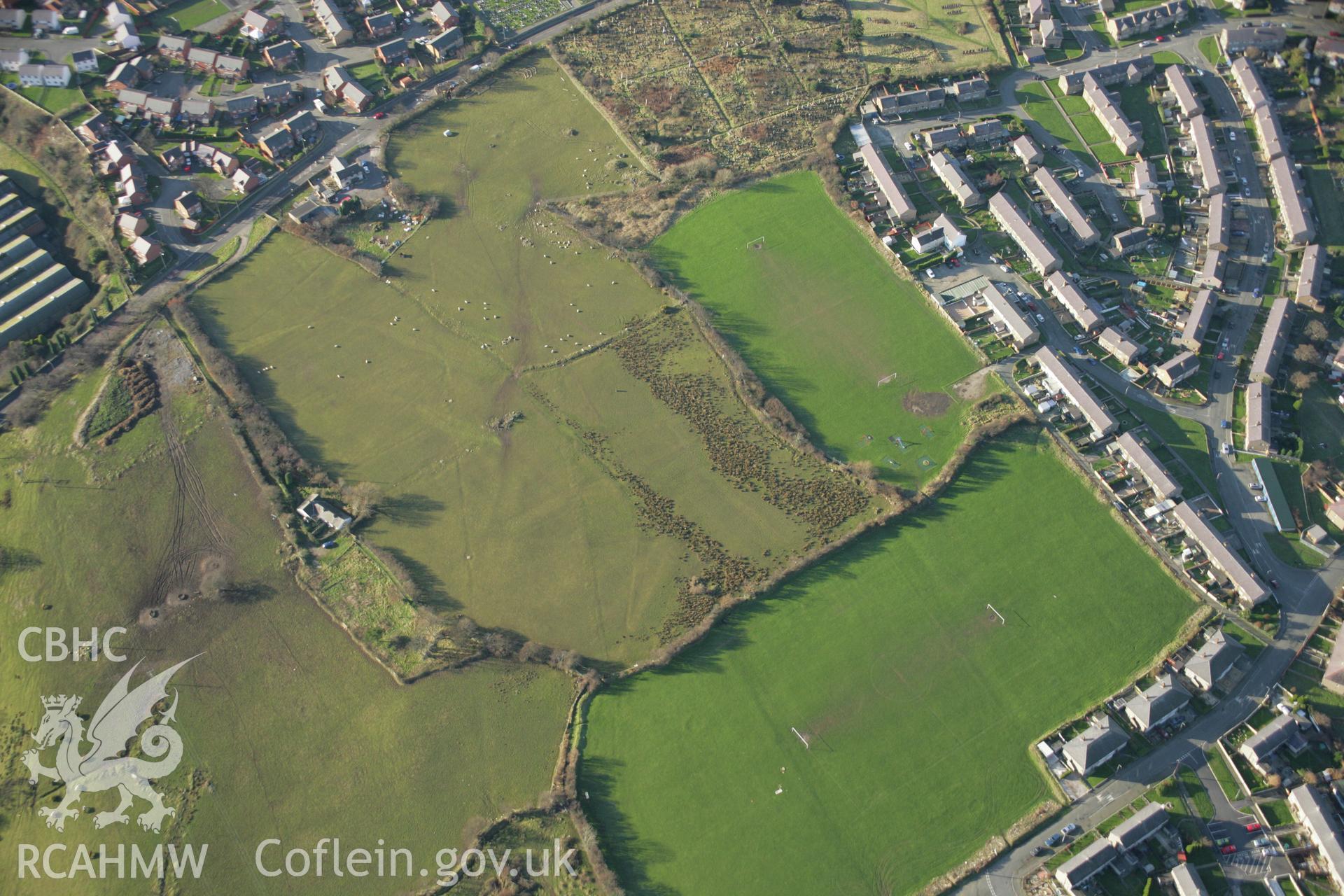 RCAHMW colour oblique aerial photograph of the Tyddyn Pandy Square Barrow Cemetery. Taken on 25 January 2007 by Toby Driver
