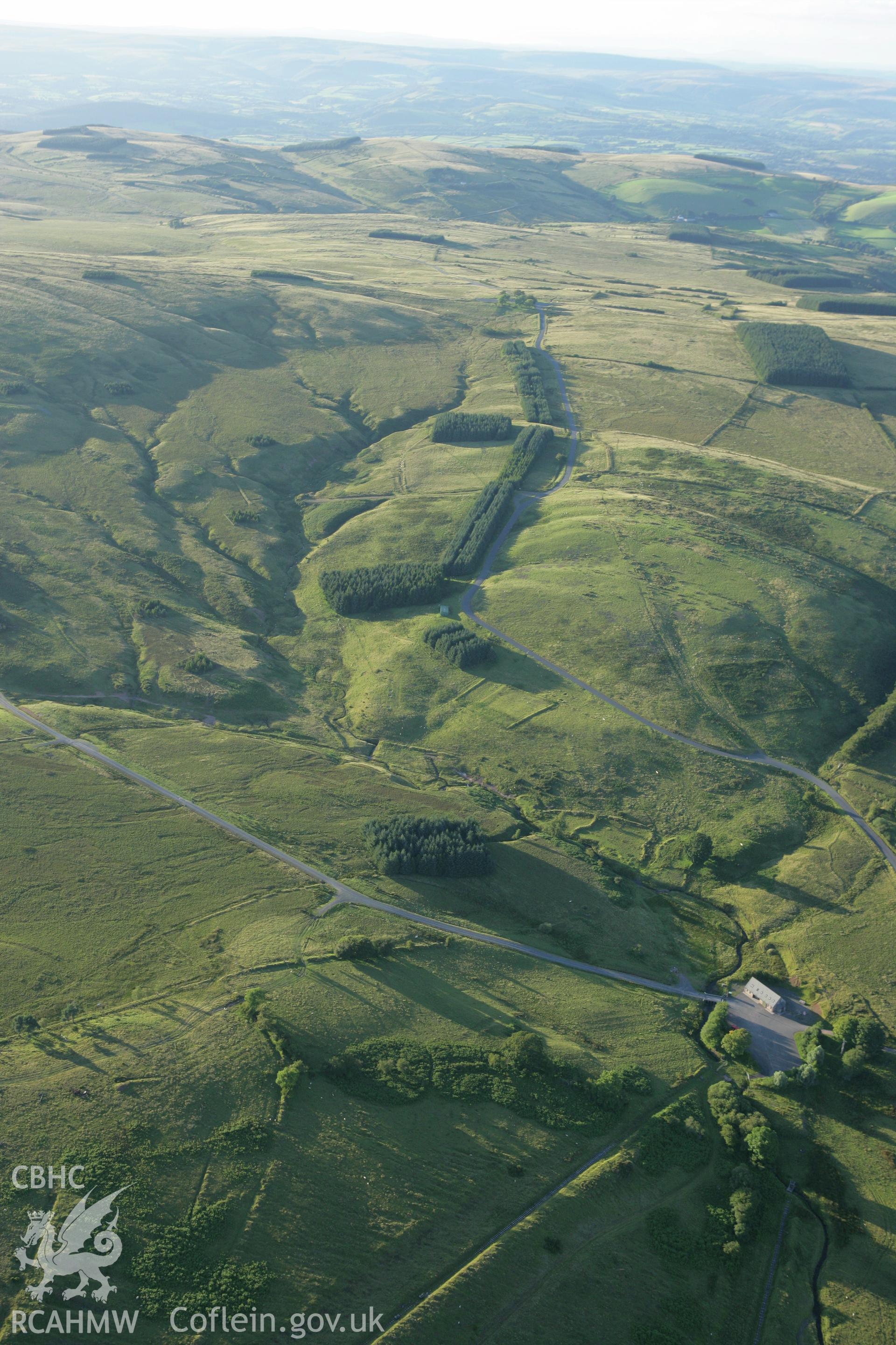 RCAHMW colour oblique aerial photograph of the army visitor centre in the former Disgwylfa Farmstead. Taken on 08 August 2007 by Toby Driver