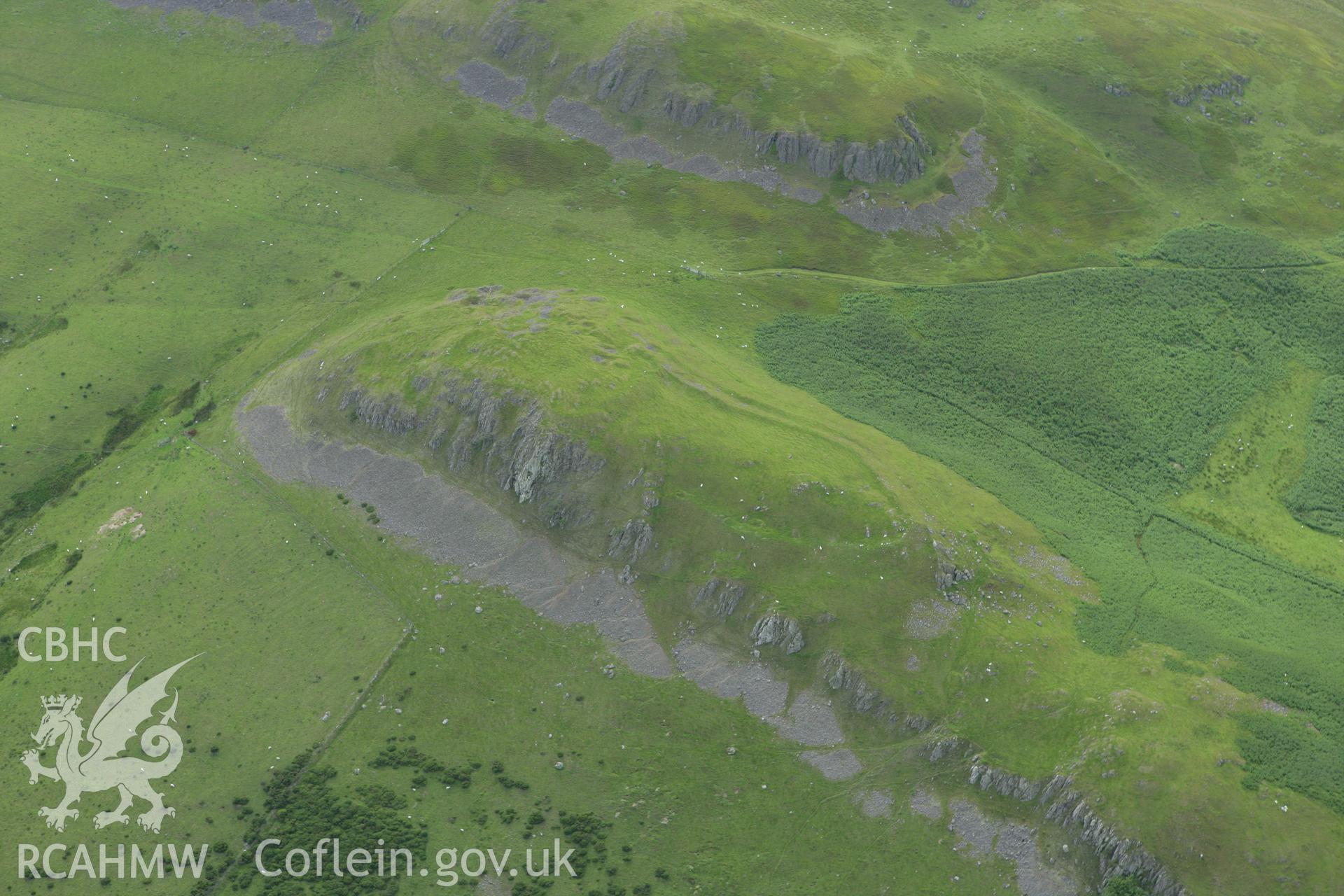RCAHMW colour oblique aerial photograph of Llandegley Rocks Enclosure. Taken on 09 July 2007 by Toby Driver