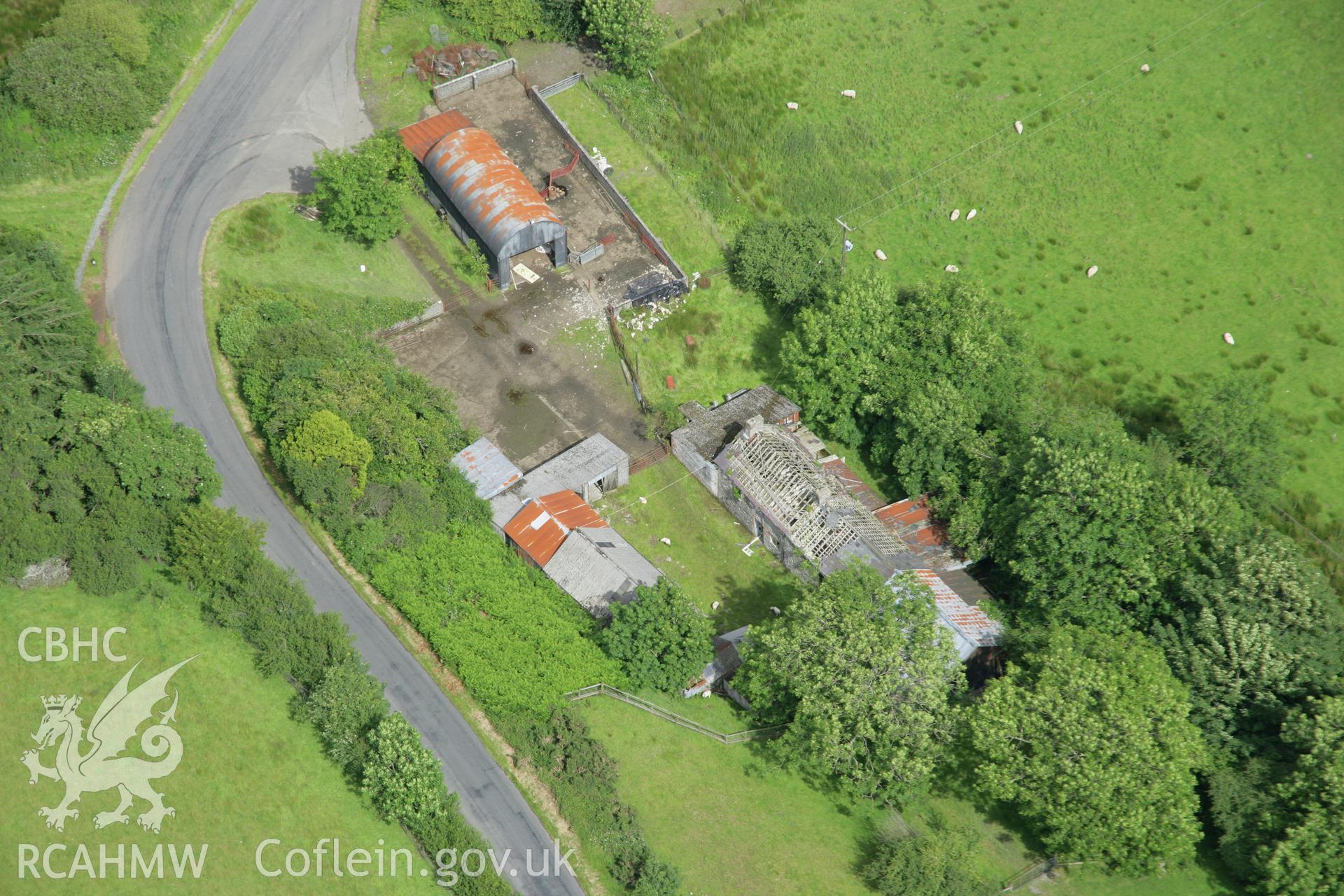 RCAHMW colour oblique aerial photograph of Spite Inn, showing the building prior to demolition. Taken on 09 July 2007 by Toby Driver