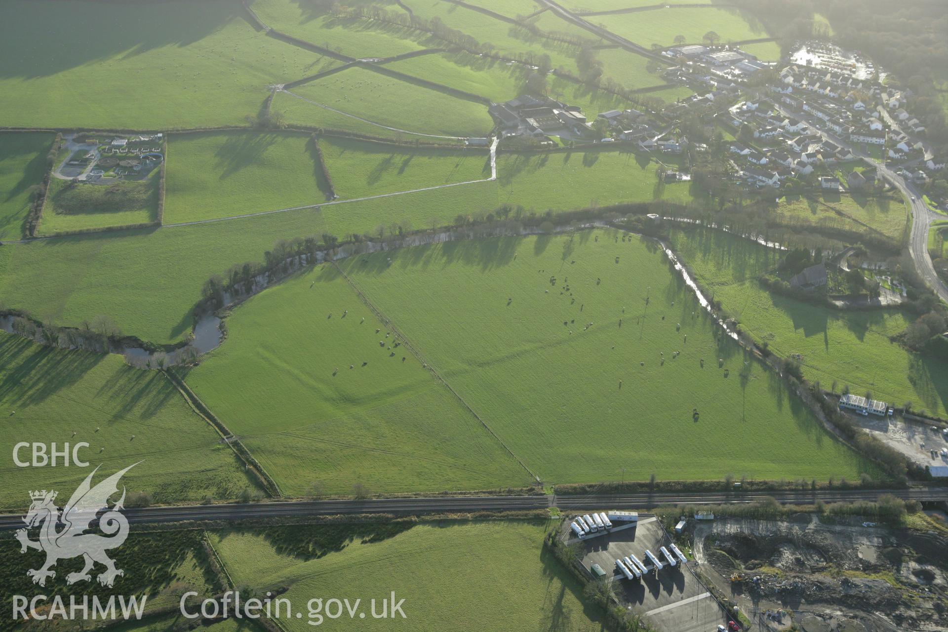 RCAHMW colour oblique photograph of St Mary's, earthworks east of. Taken by Toby Driver on 29/11/2007.
