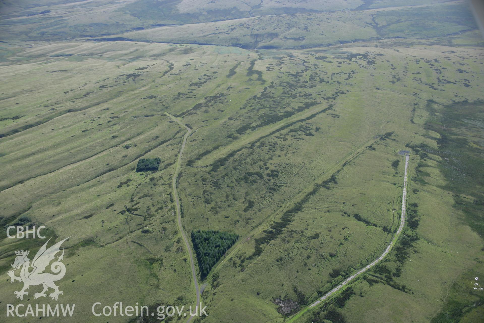 RCAHMW colour oblique aerial photograph of Artillary Range to the west of the Drover's Arms, Duhonw. Taken on 08 August 2007 by Toby Driver