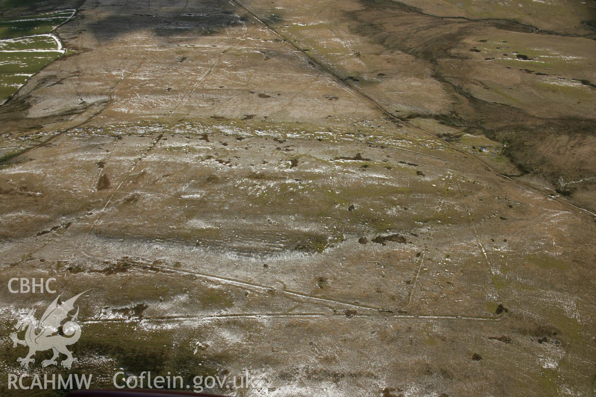RCAHMW colour oblique aerial photograph of Y Pigwn Roman Camps, Mynydd Bach Trecastell. Taken on 21 March 2007 by Toby Driver