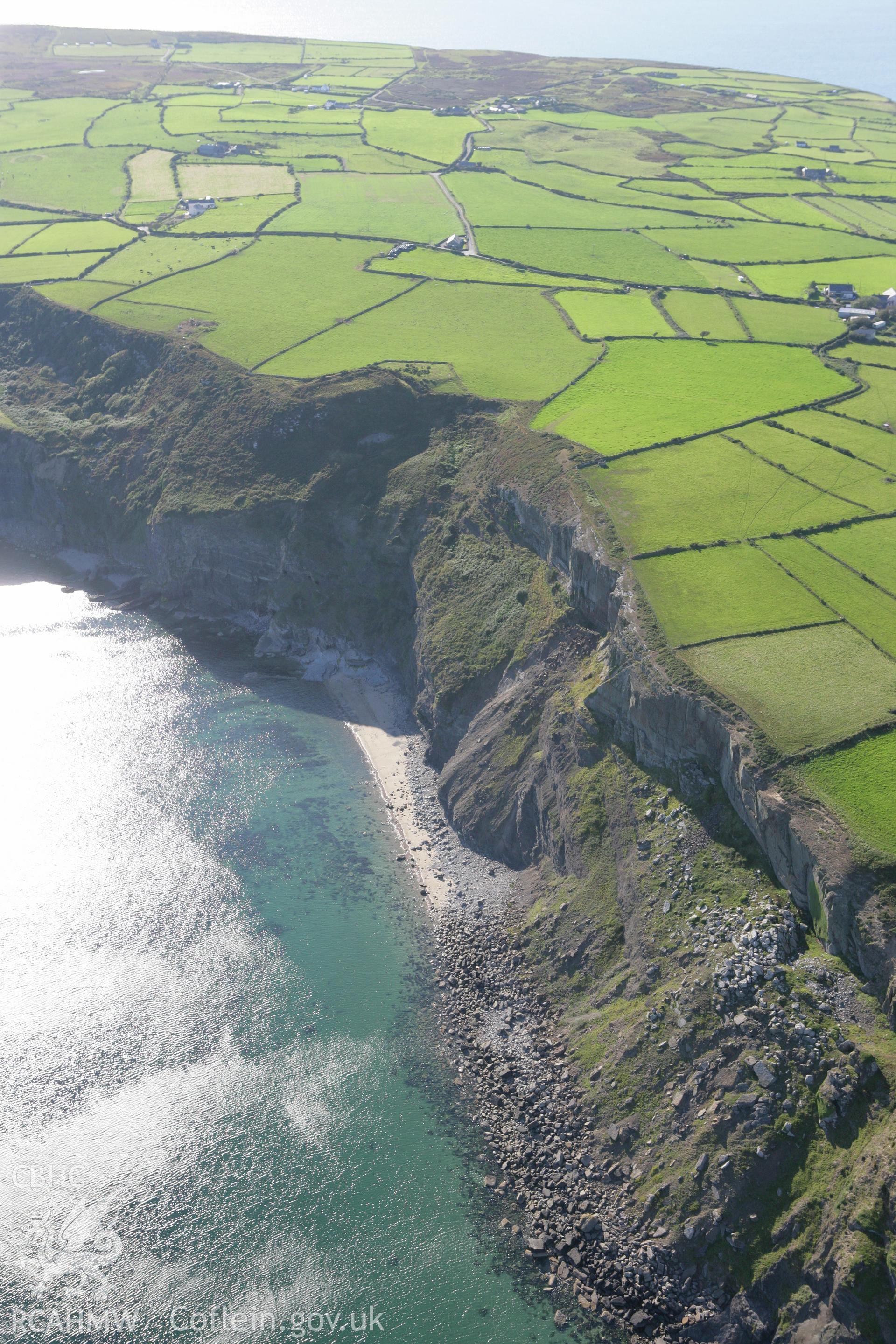 RCAHMW colour oblique aerial photograph of Pared Mawr Camp with promontory fort, Porth Ceiriad. Taken on 06 September 2007 by Toby Driver