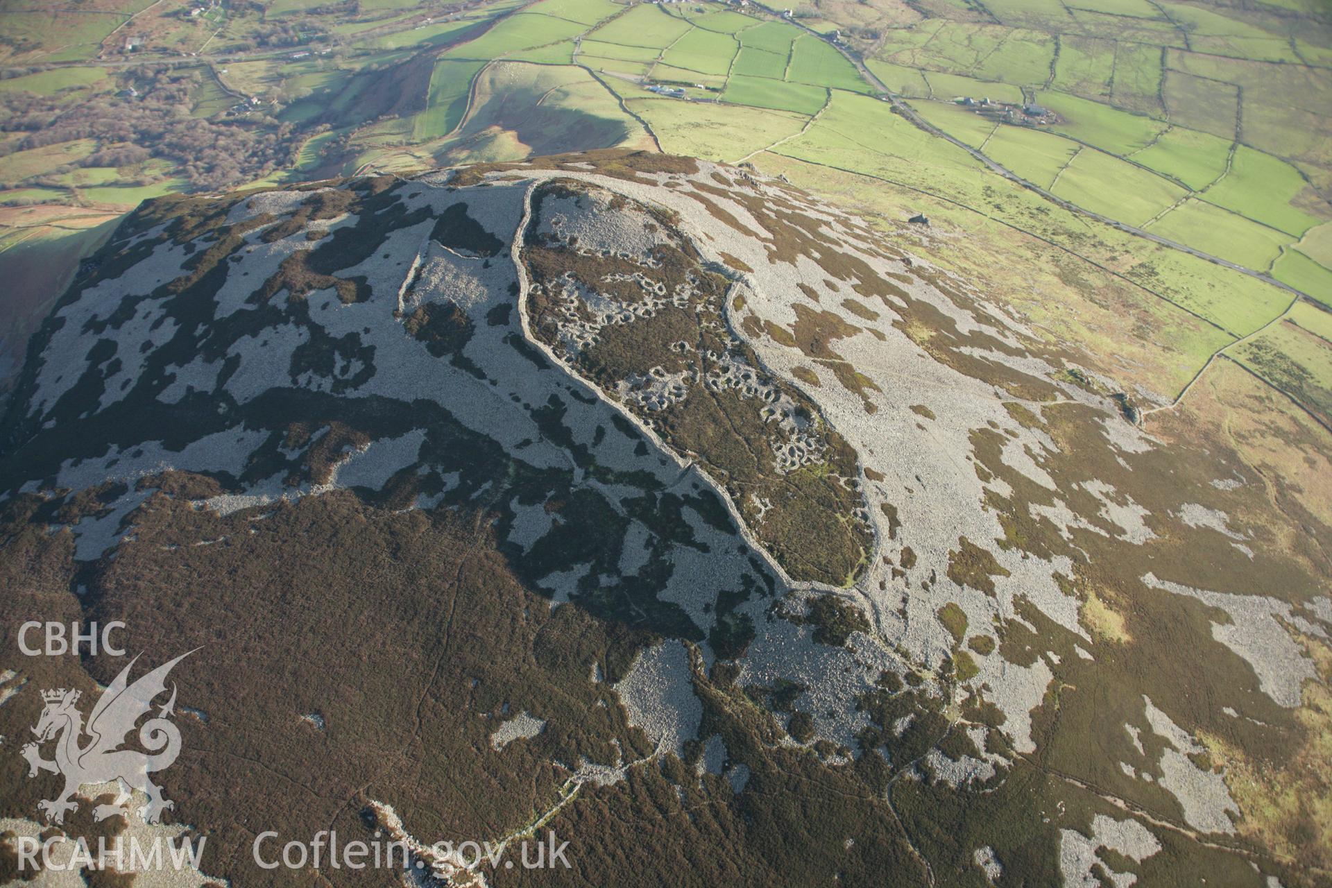 RCAHMW colour oblique aerial photograph of Tre'r Ceiri Fort, Llanaelhaearn. Taken on 25 January 2007 by Toby Driver