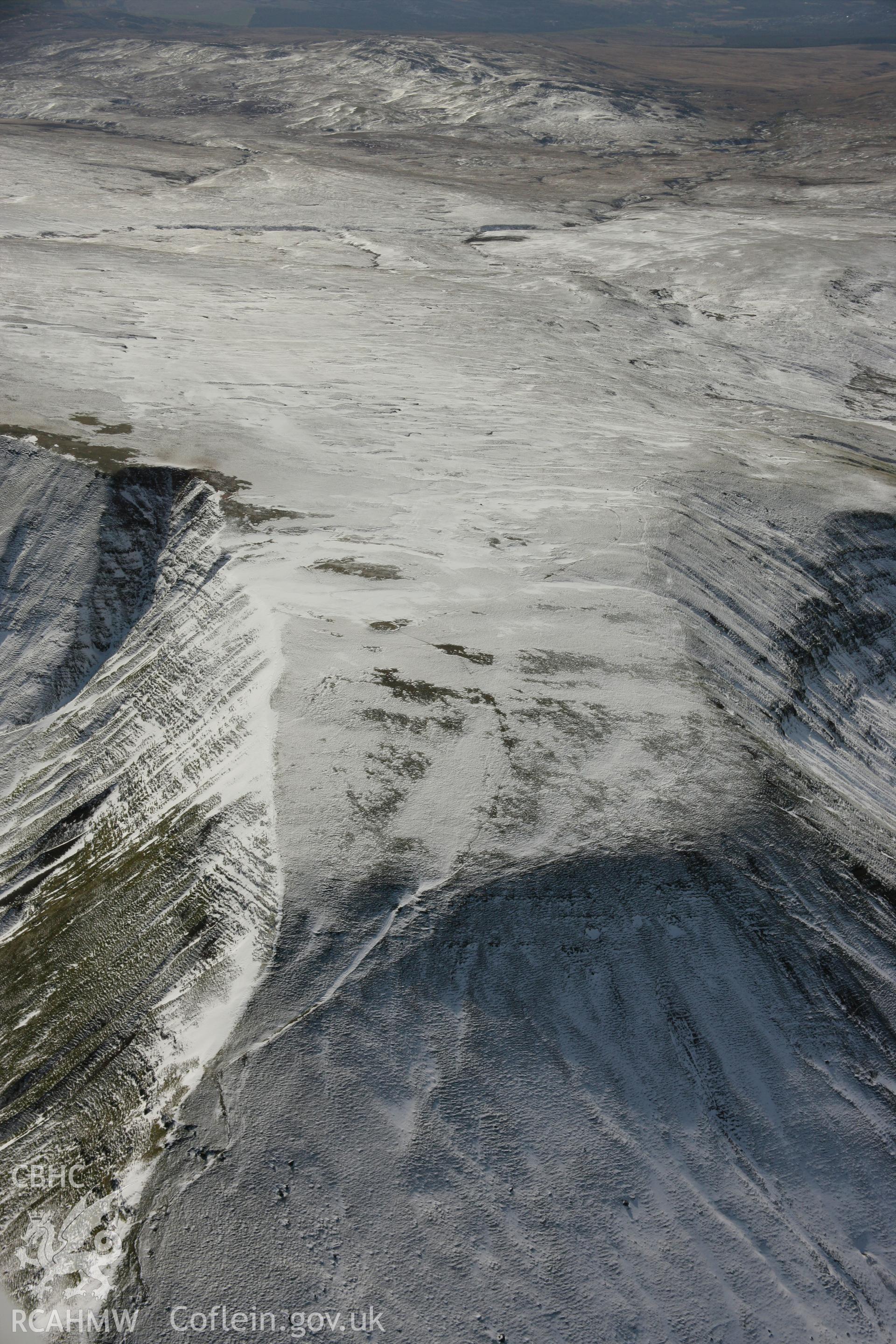 RCAHMW colour oblique aerial photograph of Fan Foel Round Barrow. Taken on 21 March 2007 by Toby Driver