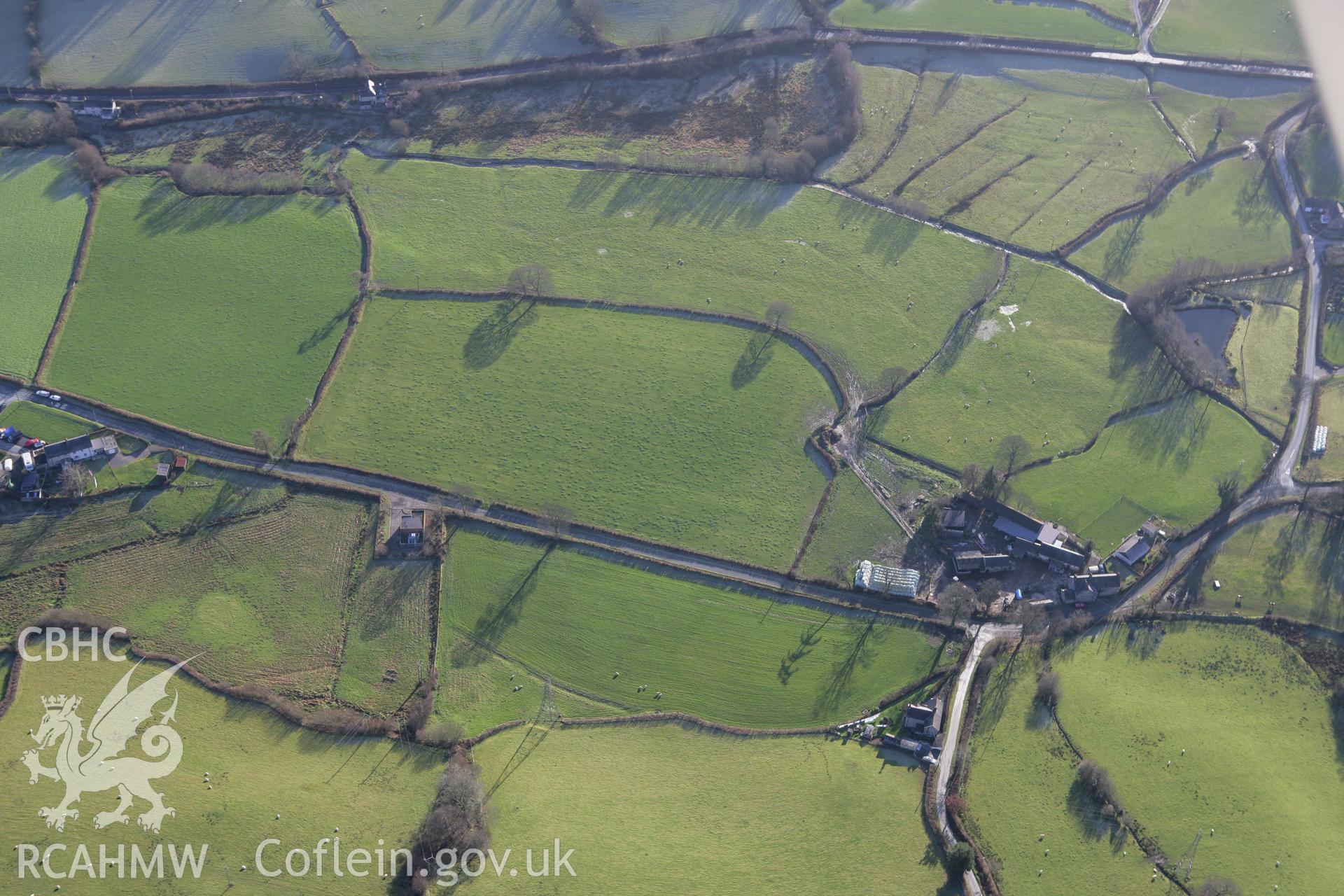 RCAHMW colour oblique photograph of Llawr y Bettws enclosure, site of. Taken by Toby Driver on 11/12/2007.