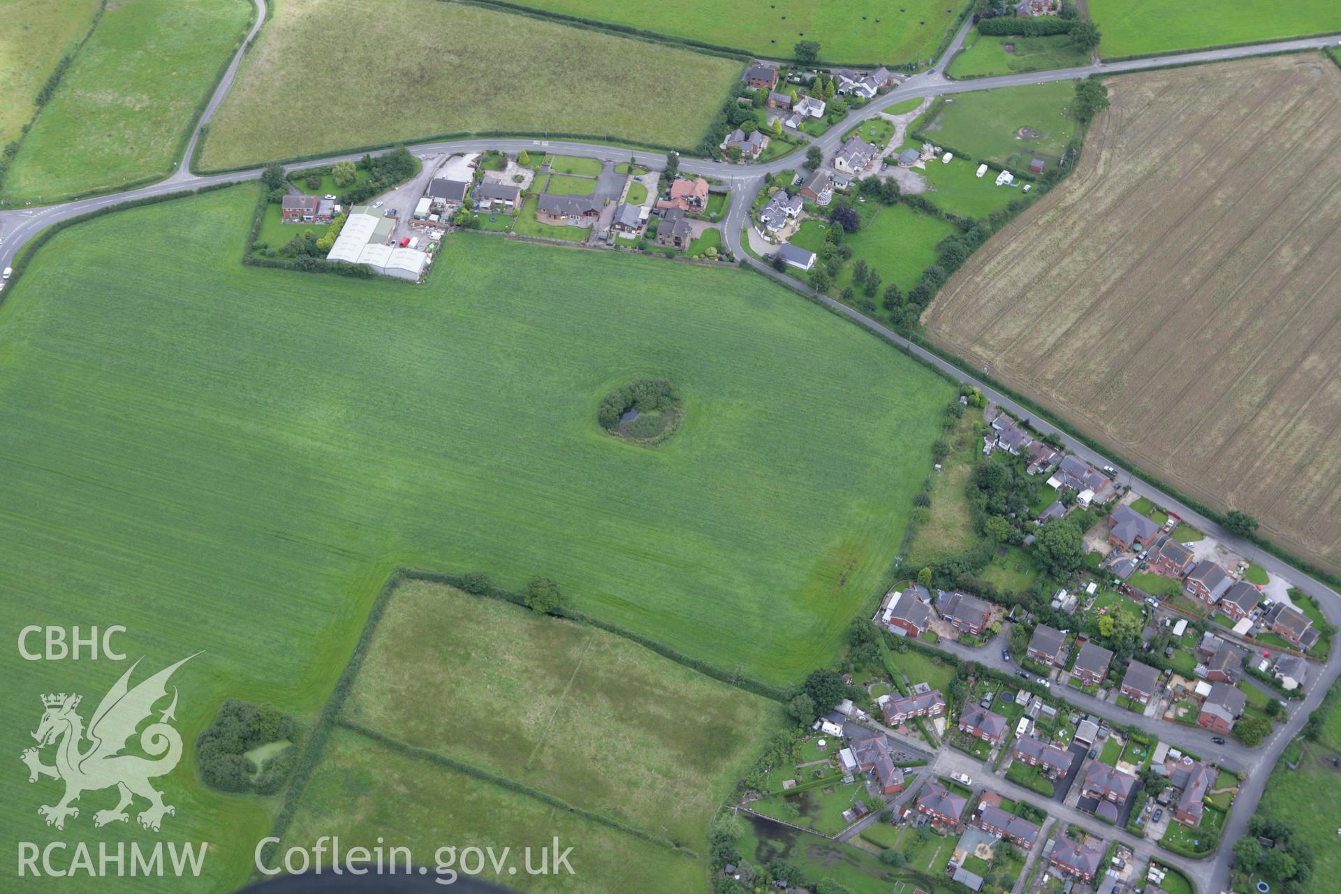 RCAHMW colour oblique aerial photograph of Trevalyn village, showing Trefalun English Congregational Chapel (Allington), Trefalun. Taken on 24 July 2007 by Toby Driver