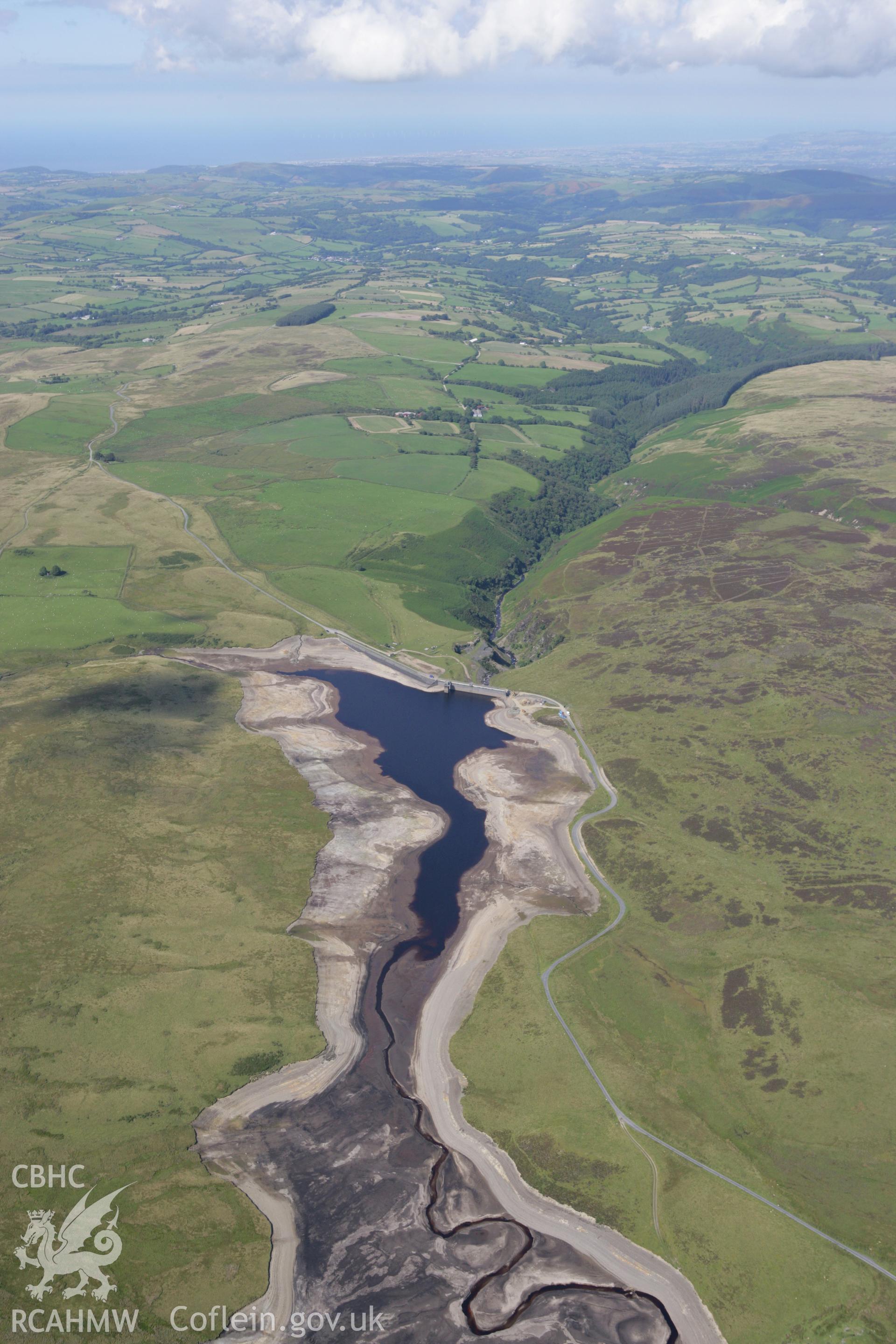 RCAHMW colour oblique aerial photograph showing landscape of Llyn Aled Isaf Mesolithic Occupation Site. Taken on 31 July 2007 by Toby Driver