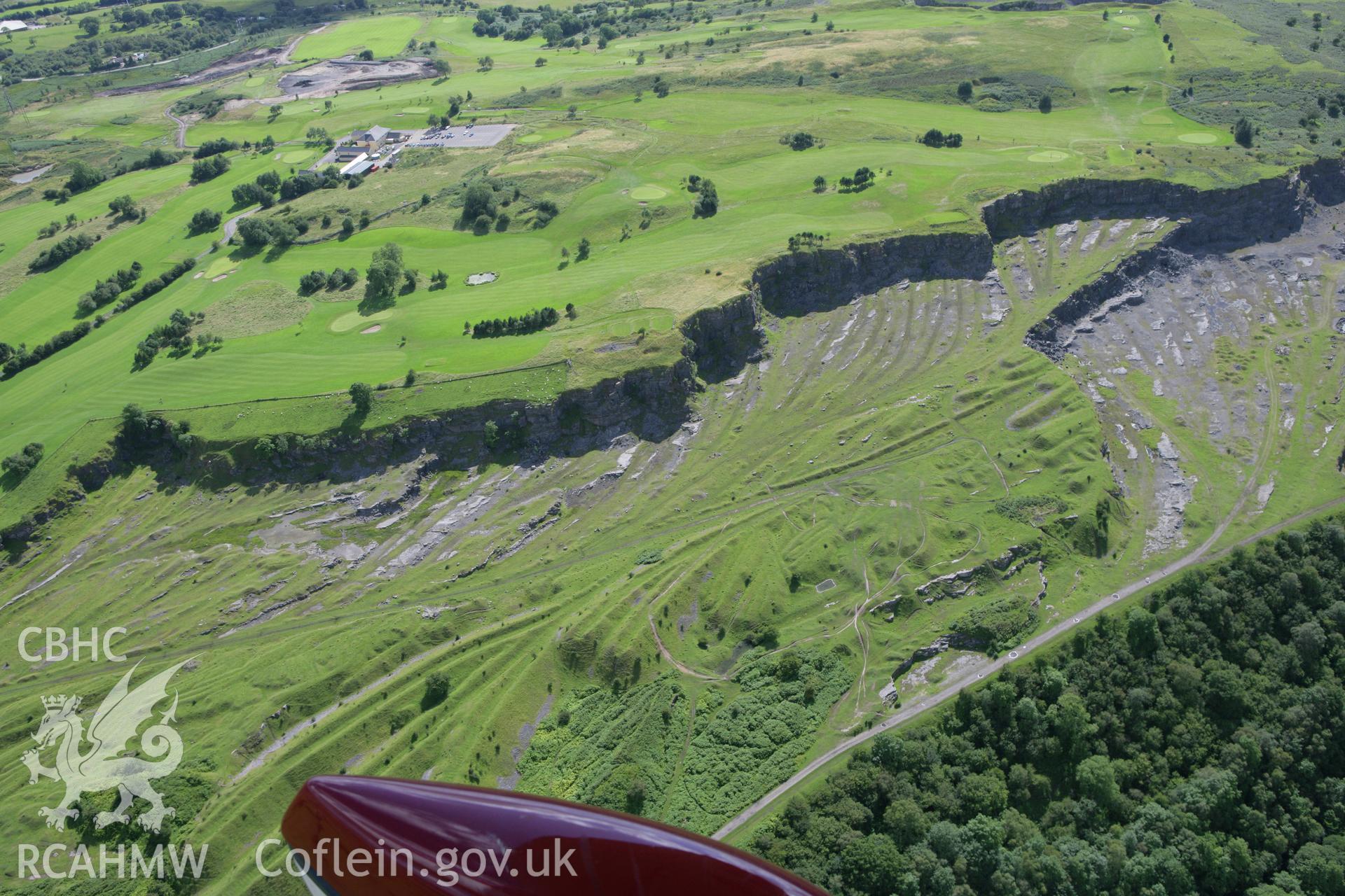 RCAHMW colour oblique aerial photograph of Morlais Castle Quarries. Taken on 30 July 2007 by Toby Driver