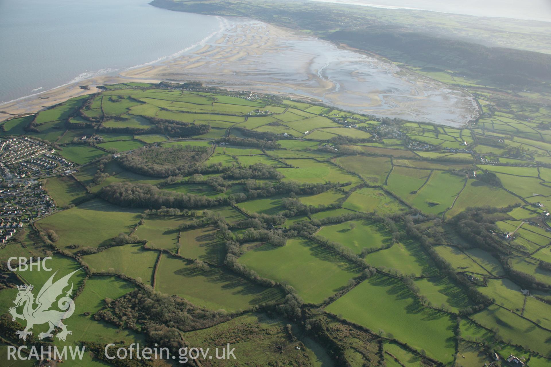 RCAHMW colour oblique aerial photograph of the Viking settlement at Glyn, Llanbedrgoch. Taken on 25 January 2007 by Toby Driver