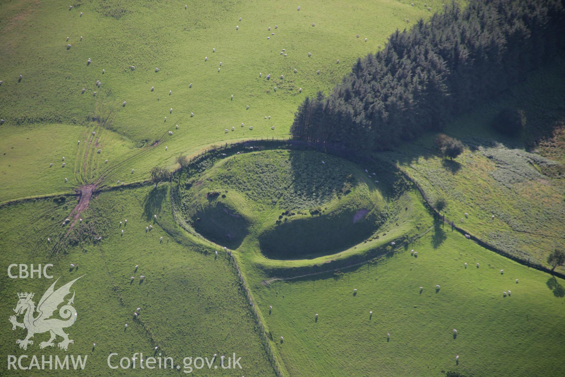 RCAHMW colour oblique aerial photograph of Waun Gynllwch (Coed Caeau) Defended Enclosure. Taken on 08 August 2007 by Toby Driver