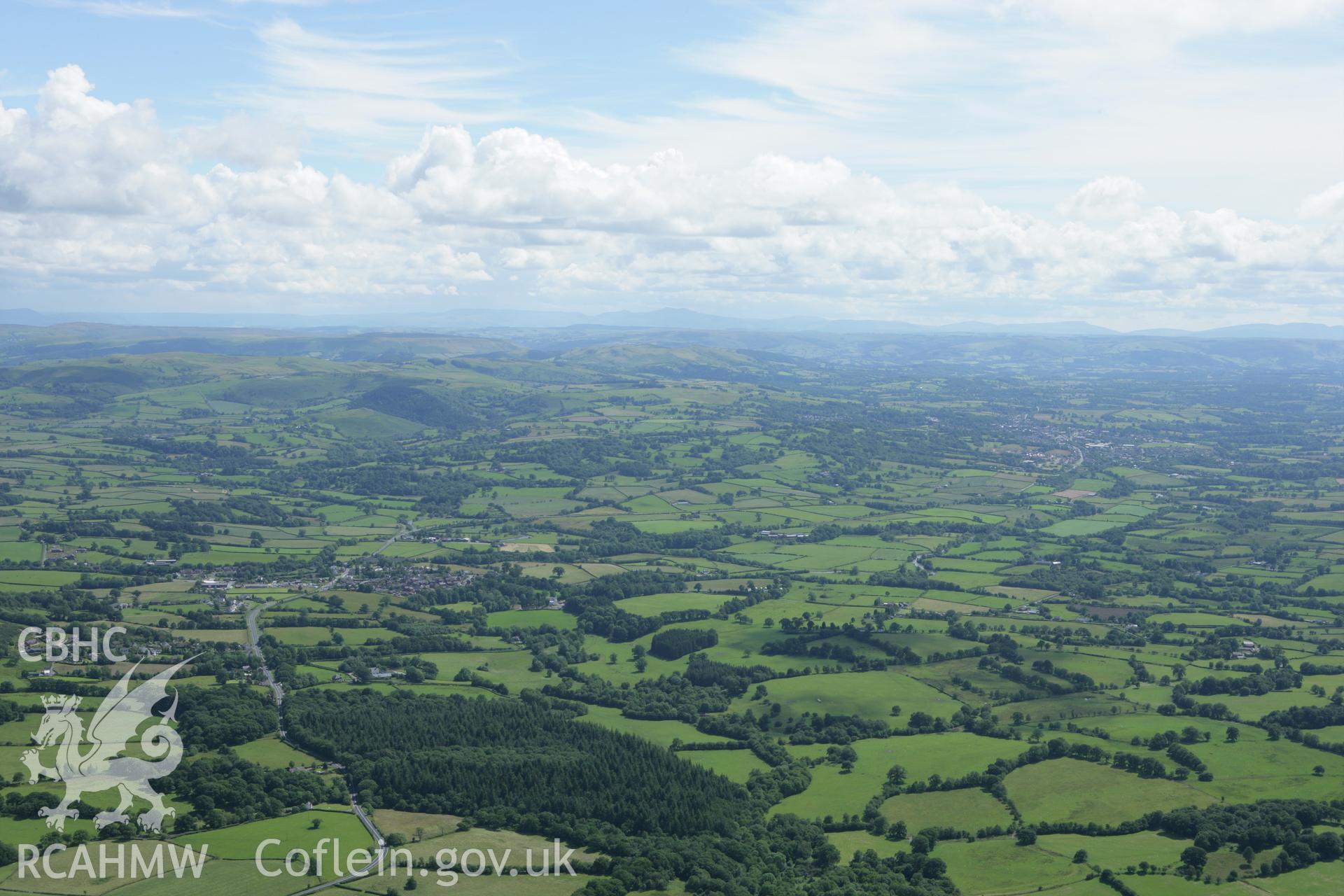 RCAHMW colour oblique aerial photograph showing landscape to the south from Crossgates to Llandrindod Wells. Taken on 09 July 2007 by Toby Driver