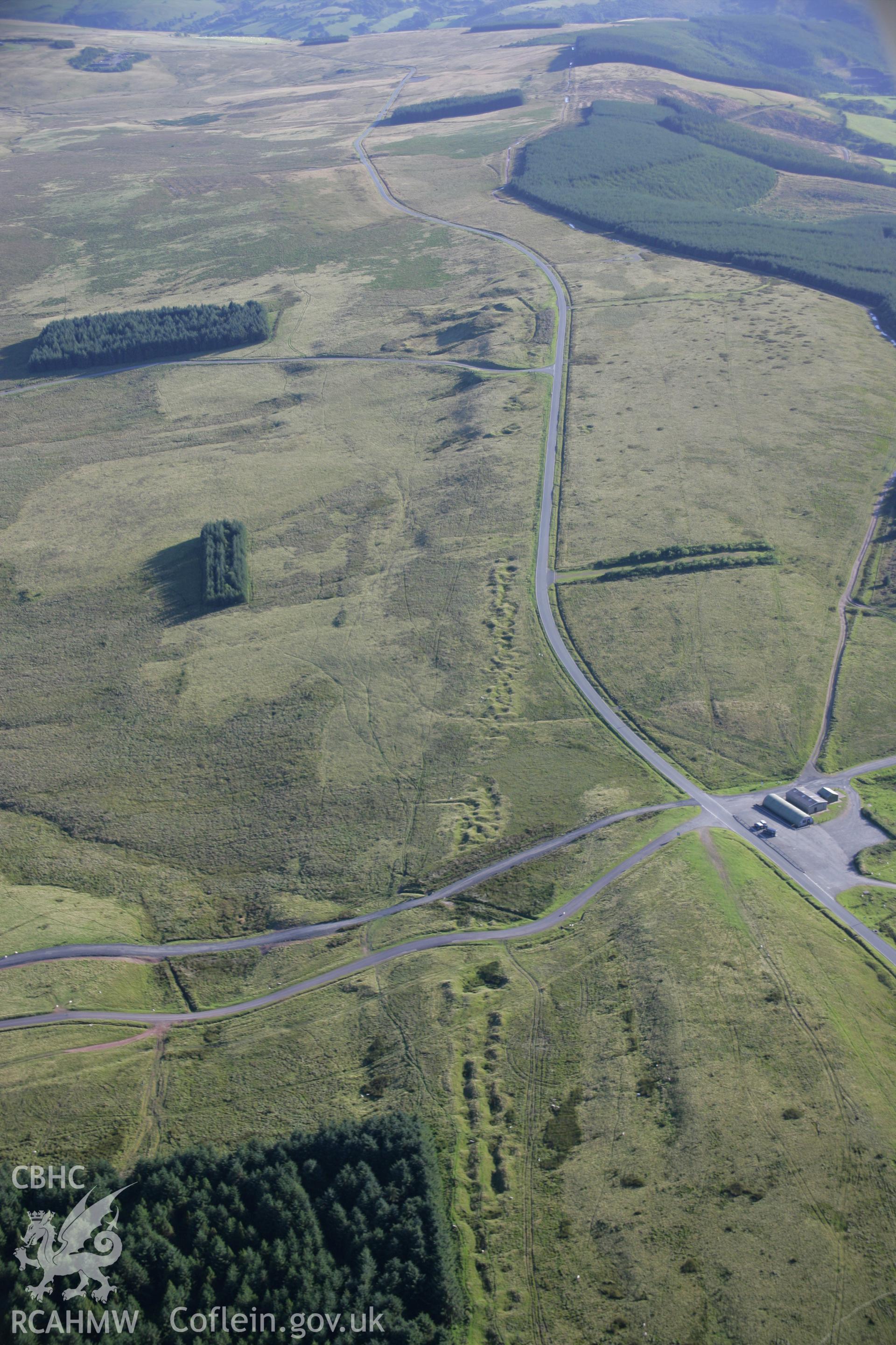RCAHMW colour oblique aerial photograph of Sennybridge Military Training Area, Mynydd Epynt, showing the Dixie's Corner landscape. Taken on 08 August 2007 by Toby Driver