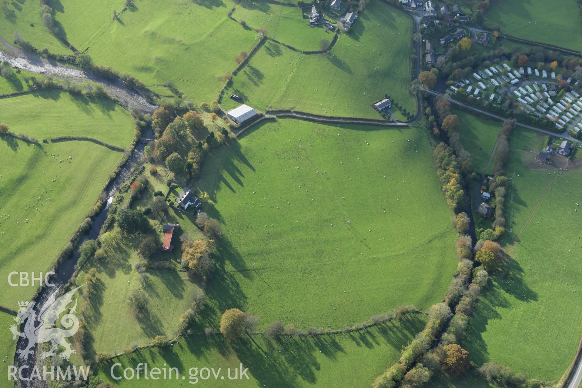 RCAHMW colour oblique photograph of St Cadfan's Church, and surrounding earthworks of former field boundaries. Taken by Toby Driver on 30/10/2007.