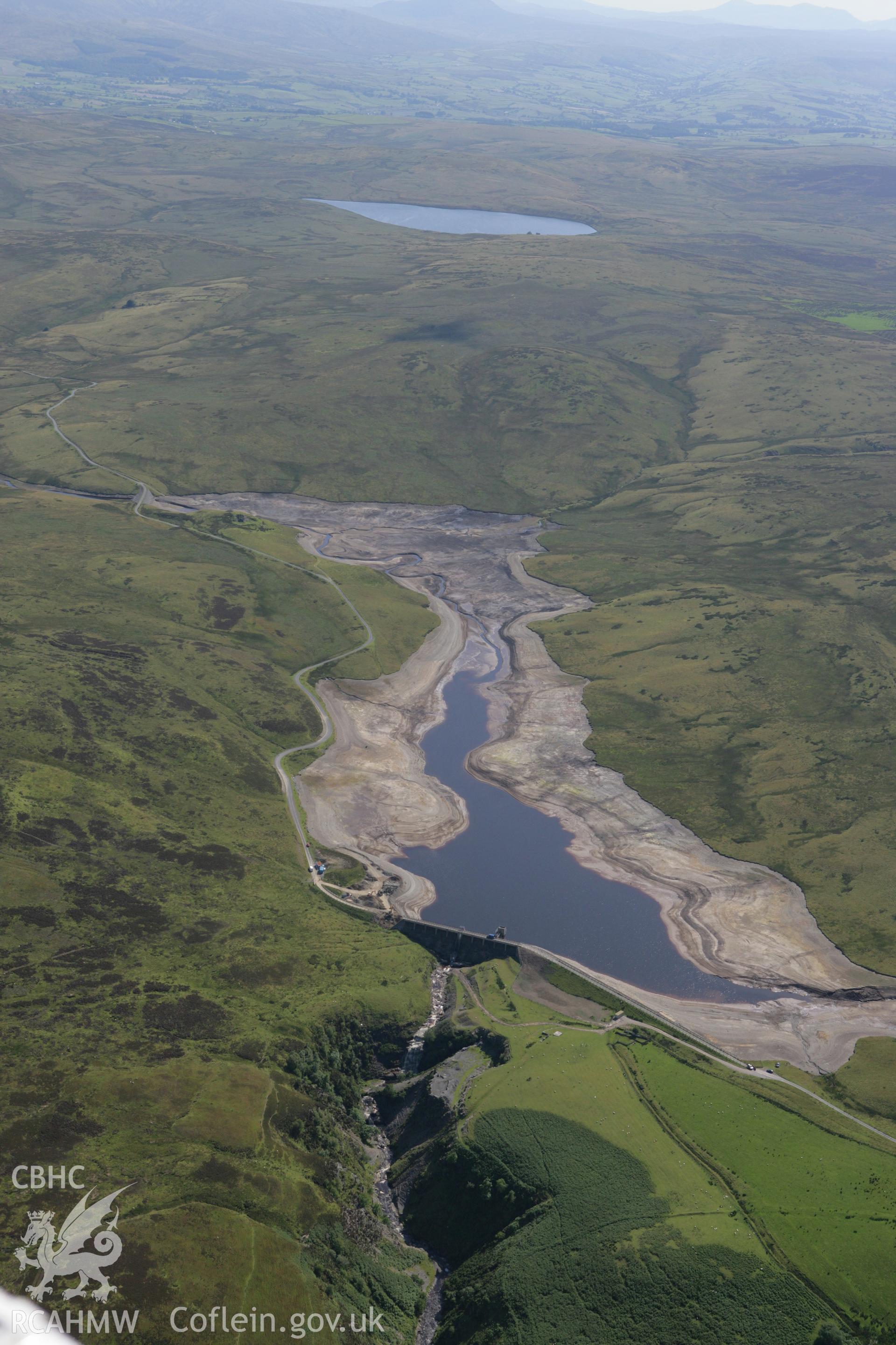 RCAHMW colour oblique aerial photograph showing landscape of Llyn Aled Isaf Mesolithic Occupation Site. Taken on 31 July 2007 by Toby Driver